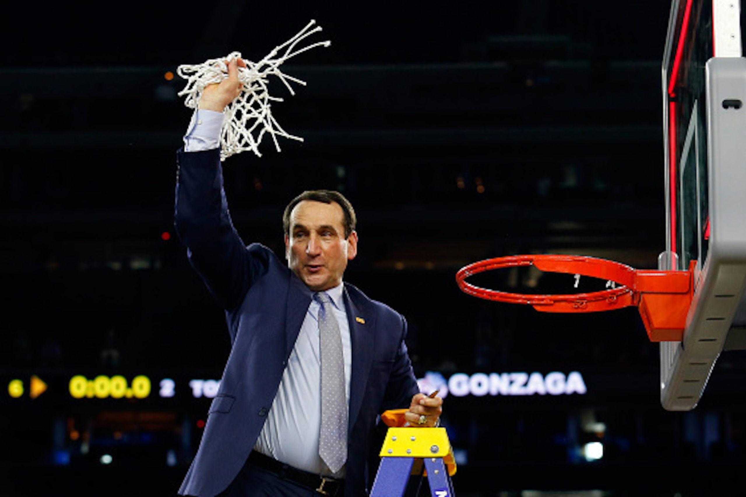 HOUSTON, TX - MARCH 29:  Head coach Mike Krzyzewski of the Duke Blue Devils cuts down the net after defeating the Gonzaga Bulldogs 66-52 in the South Regional Final of the 2015 NCAA Men's Basketball Tournament at NRG Stadium on March 29, 2015 in Houston, 
