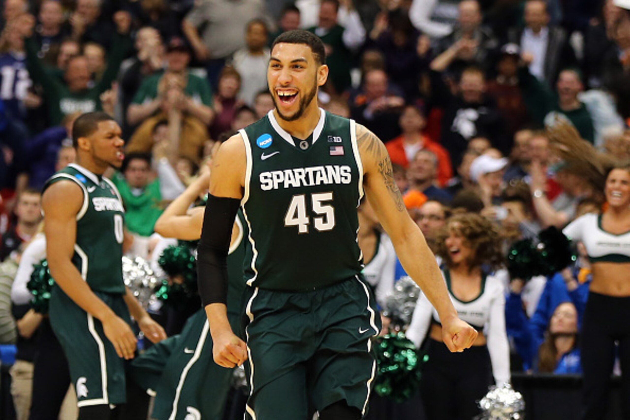 SYRACUSE, NY - MARCH 27:  Denzel Valentine #45 of the Michigan State Spartans celebrates after defeating the Oklahoma Sooners 62 to 58 during the East Regional Semifinal of the 2015 NCAA Men's Basketball Tournament at the Carrier Dome on March 27, 2015 in