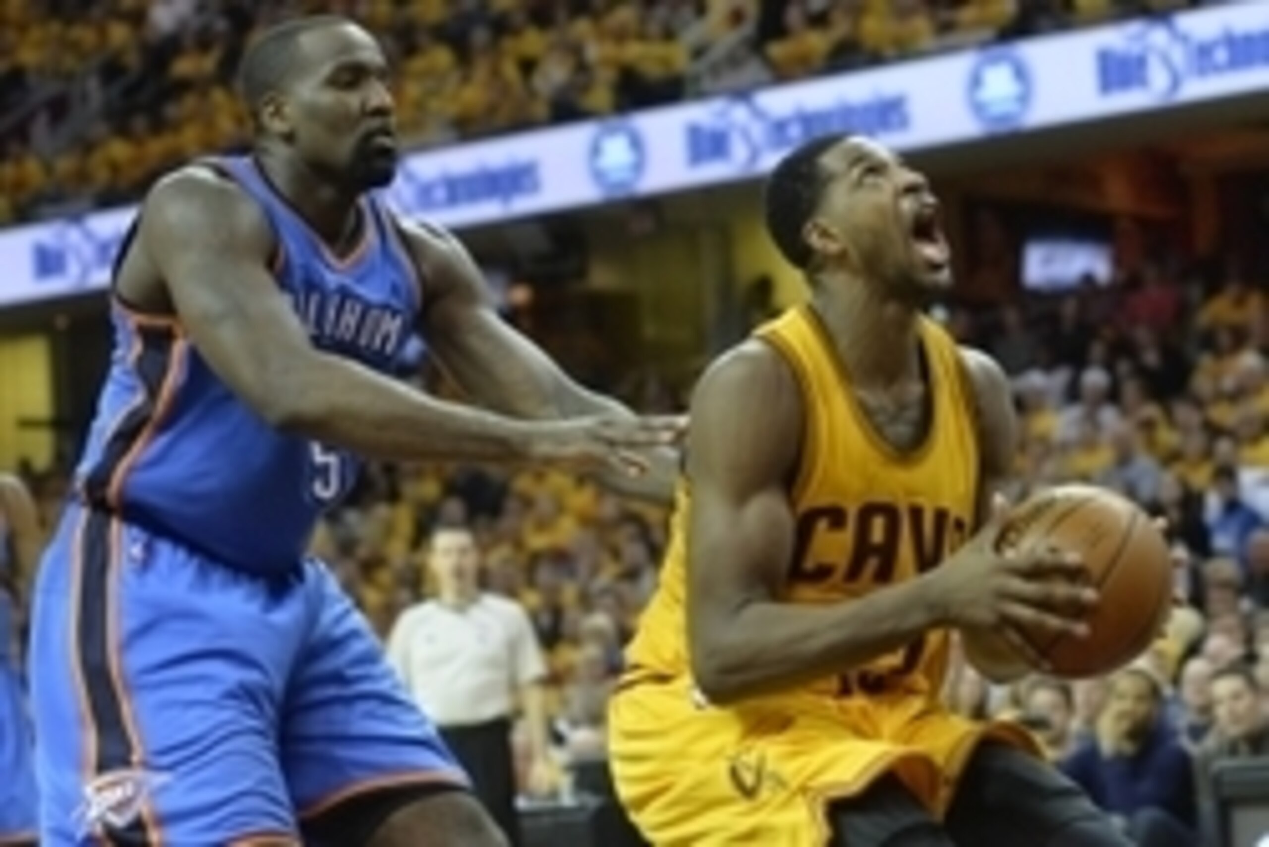 Jan 25, 2015; Cleveland, OH, USA; Cleveland Cavaliers center Tristan Thompson (13) drives to the basket against Oklahoma City Thunder center Kendrick Perkins (5) in the fourth quarter at Quicken Loans Arena. Mandatory Credit: David Richard-USA TODAY Sport