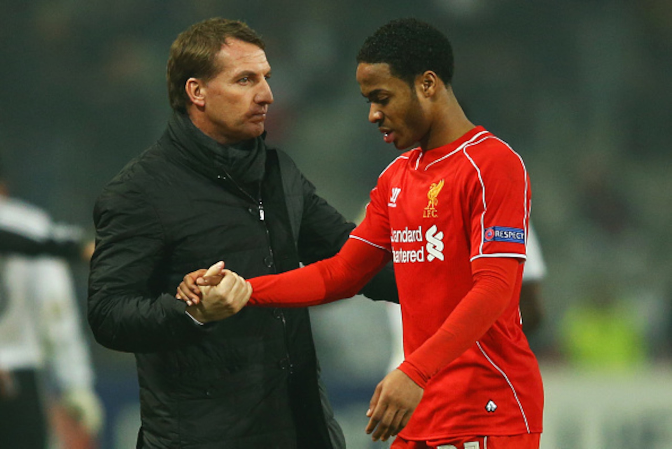 ISTANBUL, TURKEY - FEBRUARY 26:  Brendan Rodgers manager of Liverpool shakes hands with Raheem Sterling of Liverpool after defeat in a penalty shoot out during the UEFA Europa League Round of 32 second leg match between Besiktas JK and Liverpool FC on Feb