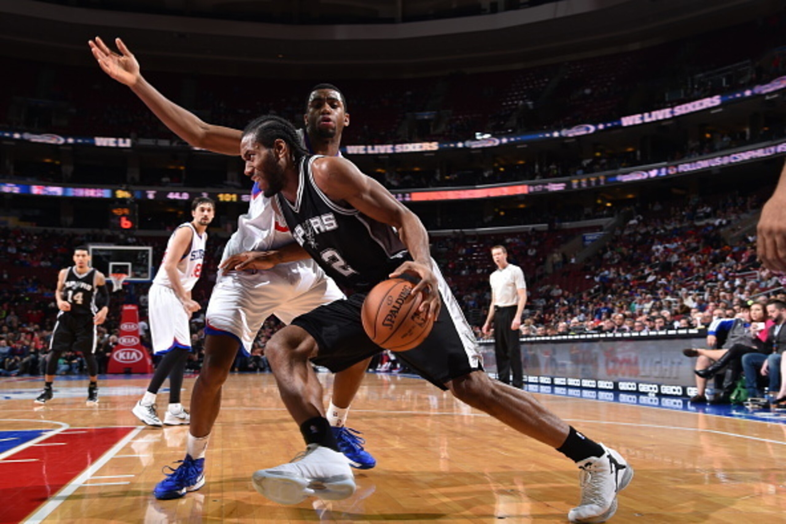 PHILADELPHIA, PA - DECEMBER 1:  Kawhi Leonard #2 of the San Antonio Spurs drives to the basket against the Philadelphia 76ers on December 1, 2014 at the Wells Fargo Center in Philadelphia, Pennsylvania.  NOTE TO USER: User expressly acknowledges and agree
