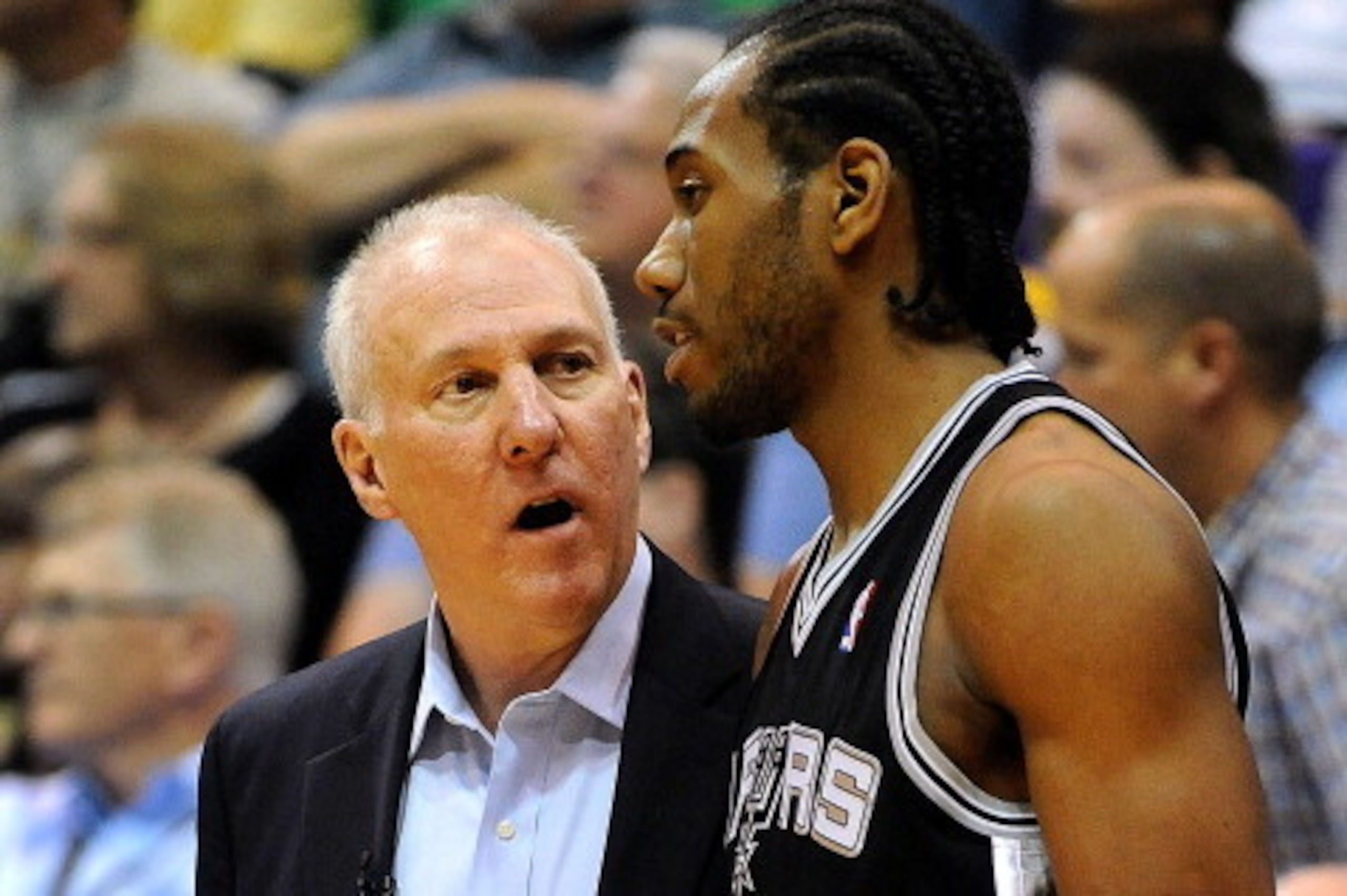 SALT LAKE CITY, UT - MAY 07: Head coach Gregg Popovich of the San Antonio Spurs speaks with Kawhi Leonard #2 of the San Antonio Spurs during the fourth quarter of Game Four of the Western Conference Quarterfinals in the 2012 NBA Playoffs at EnergySolution