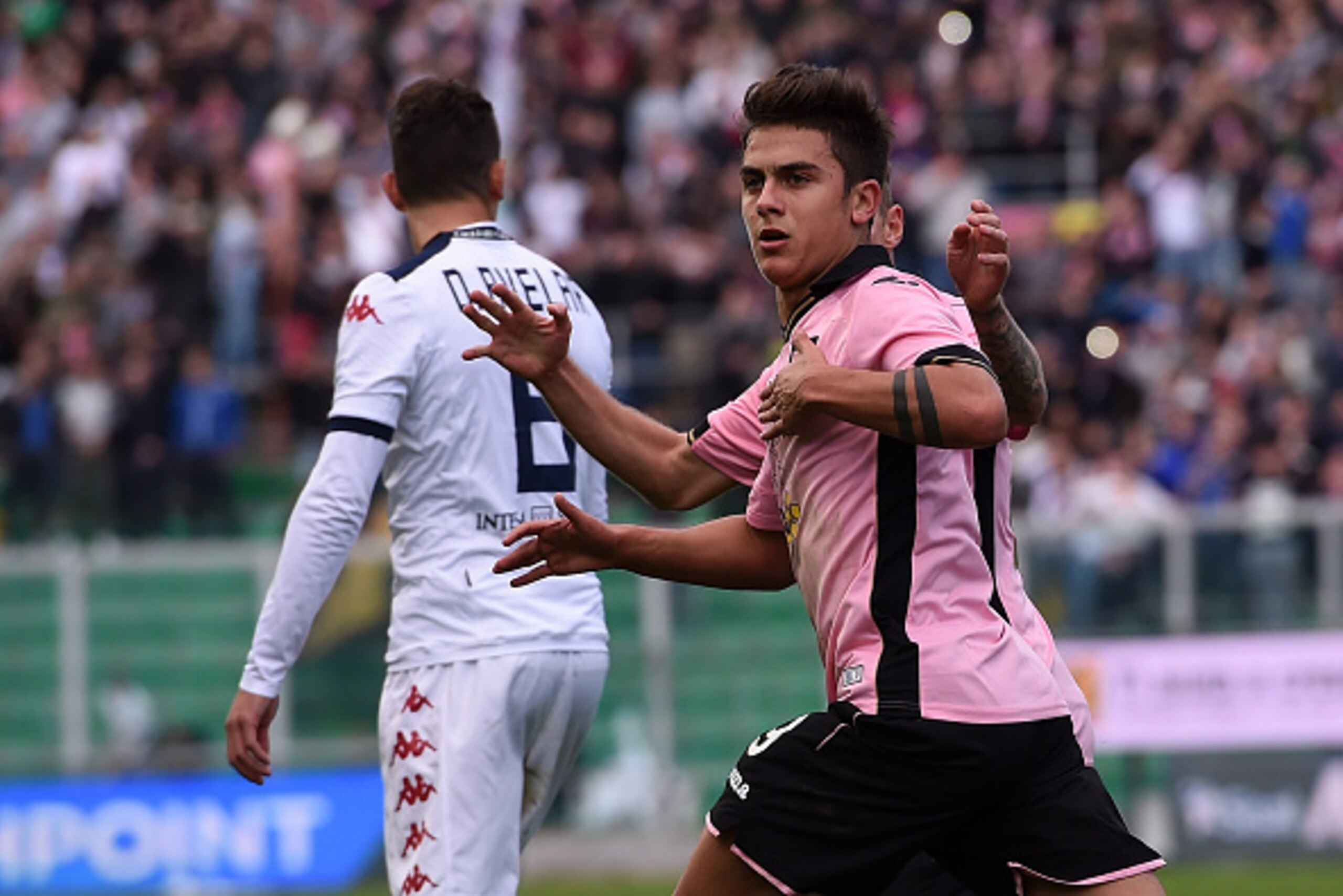 PALERMO, ITALY - JANUARY 06:  Paulo Dybala of Palermo celebrates after scoring his team's third goal during the Serie A match between US Citta di Palermo and Cagliari Calcio at Stadio Renzo Barbera on January 6, 2015 in Palermo, Italy.  (Photo by Tullio M