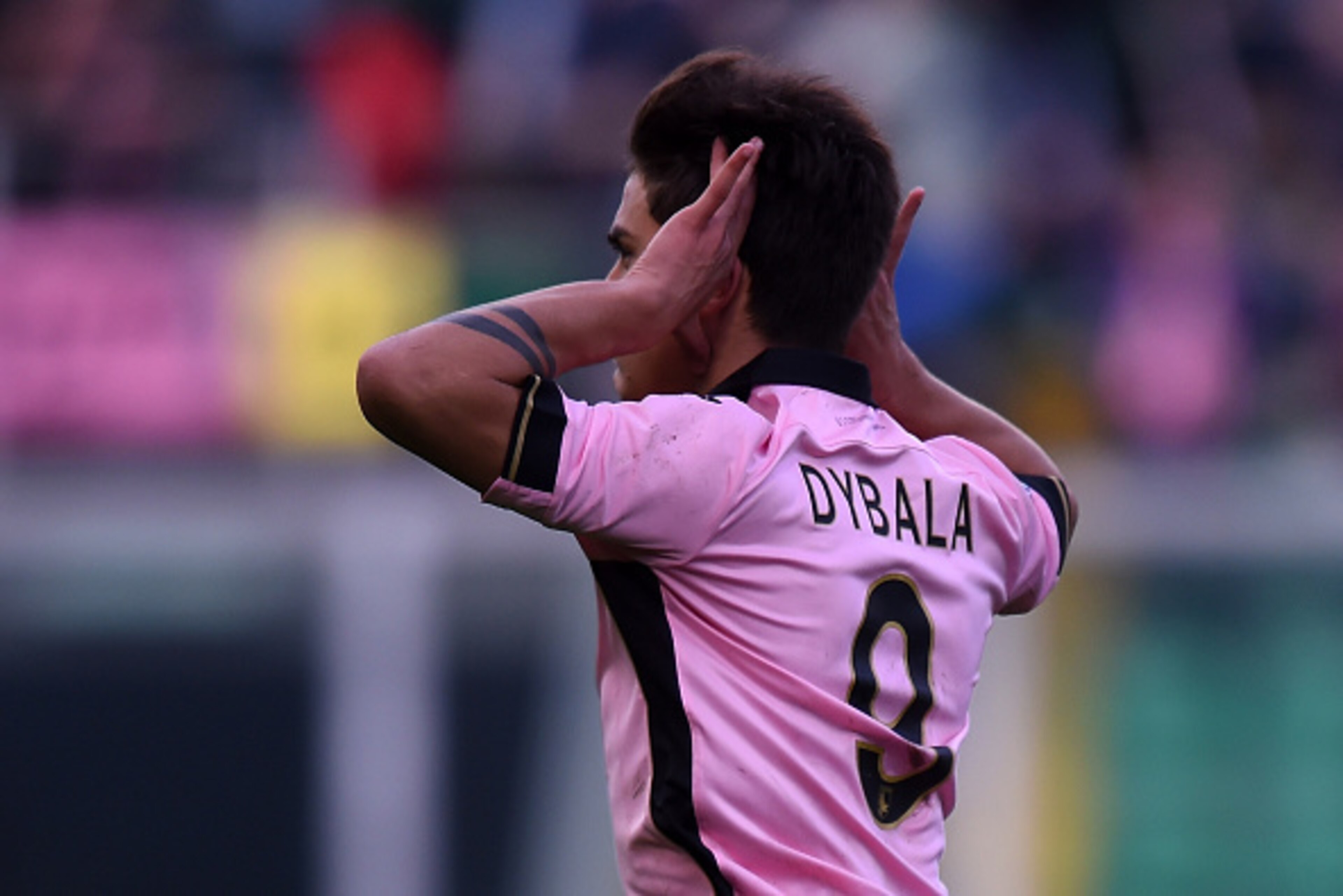 PALERMO, ITALY - FEBRUARY 01: Paulo Dybala of Palermo celebrates after scoring the equalizing goal during the Serie A match between US Citta di Palermo and Hellas Verona FC at Stadio Renzo Barbera on February 1, 2015 in Palermo, Italy. (Photo by Tullio PALERMO, ITALY - FEBRUARY 01: Paulo Dybala of Palermo celebrates after scoring the equalizing goal during the Serie A match between US Citta di Palermo and Hellas Verona FC at Stadio Renzo Barbera on February 1, 2015 in Palermo, Italy. (Photo by Tullio