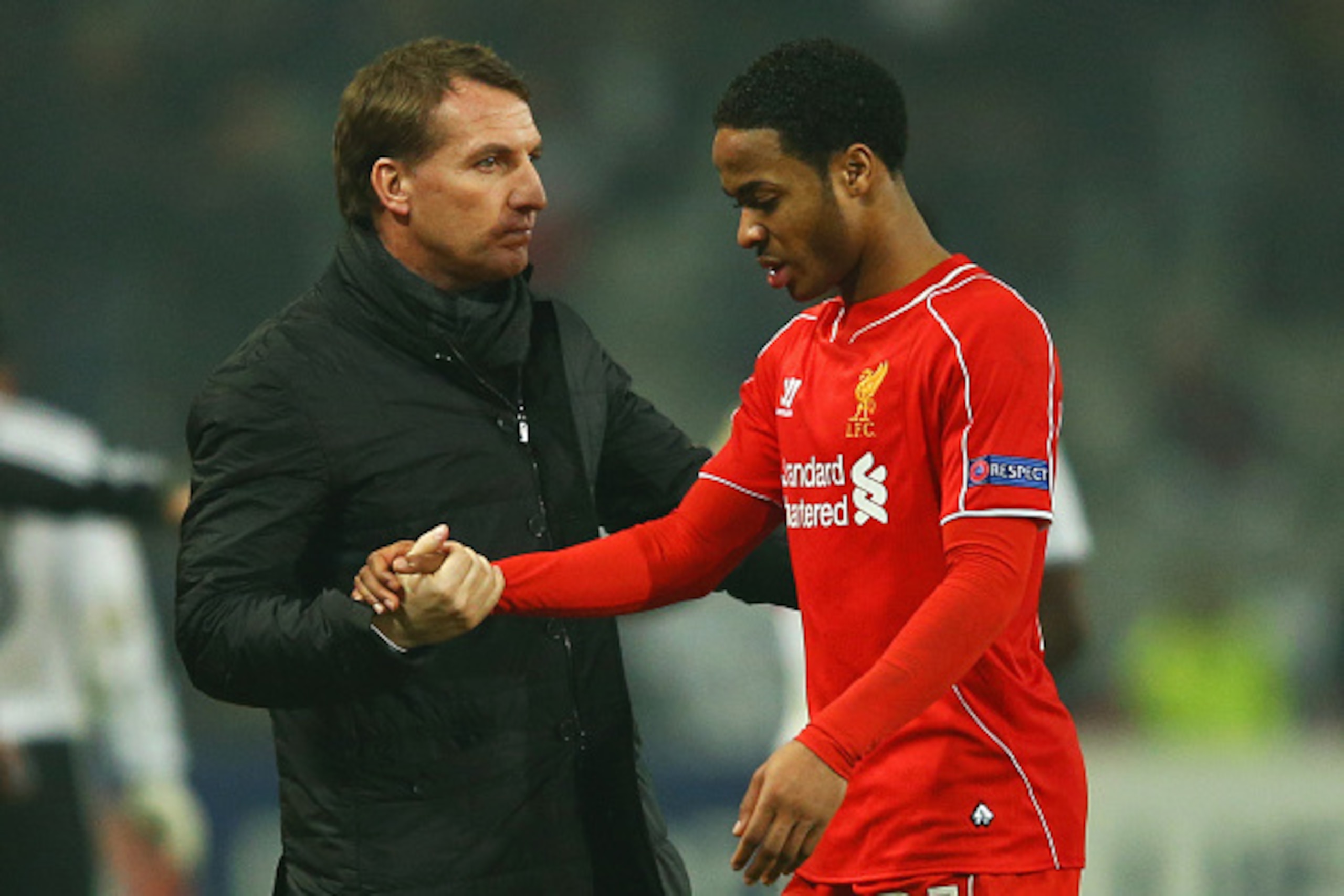 ISTANBUL, TURKEY - FEBRUARY 26:  Brendan Rodgers manager of Liverpool shakes hands with Raheem Sterling of Liverpool after defeat in a penalty shoot out during the UEFA Europa League Round of 32 second leg match between Besiktas JK and Liverpool FC on Feb