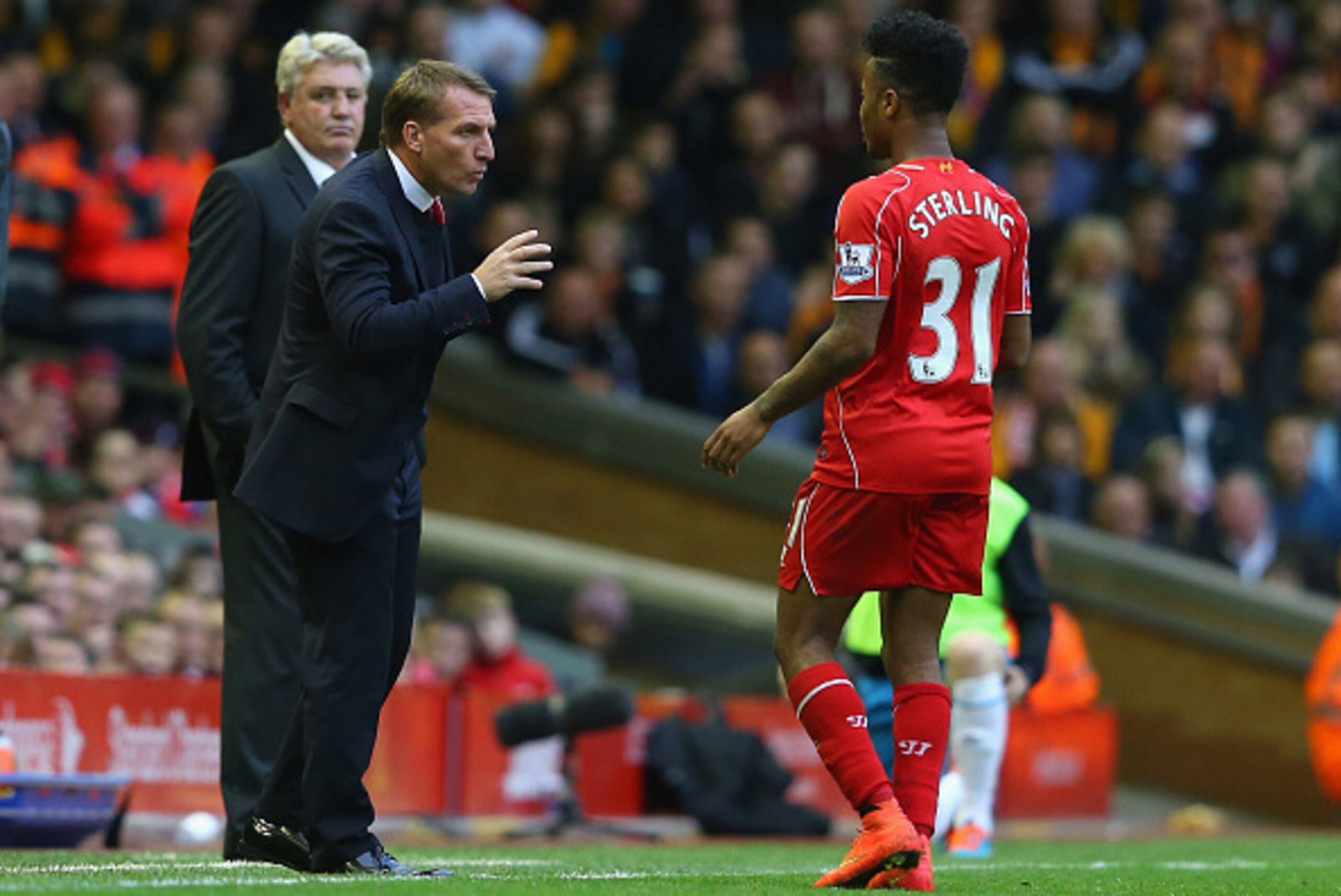 LIVERPOOL, ENGLAND - OCTOBER 25:  Brendan Rodgers the manager of Liverpool talks with Raheem Sterling during the Barclays Premier League match between Liverpool and Hull City at Anfield on October 25, 2014 in Liverpool, England.  (Photo by Alex Livesey/Ge