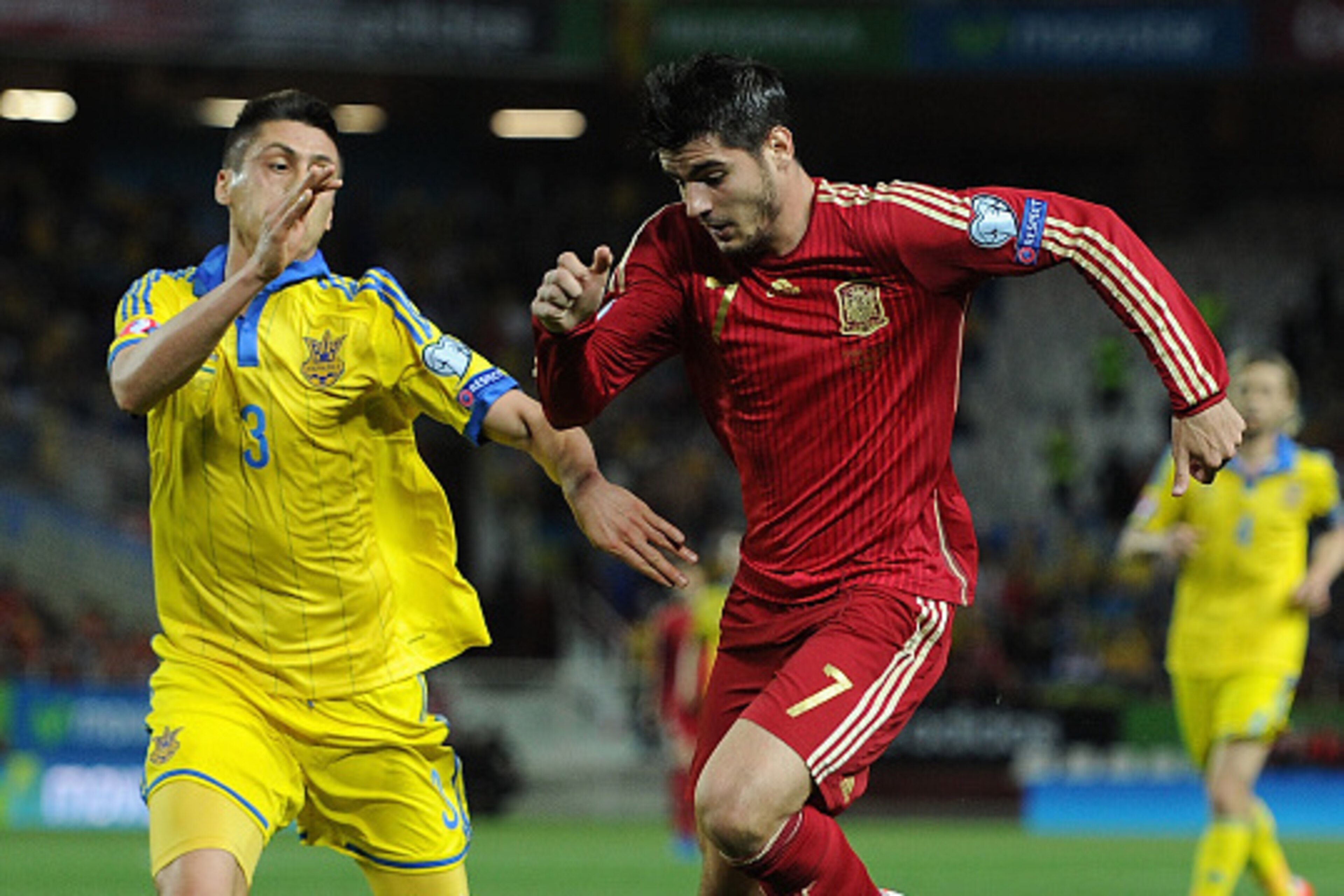SEVILLE, SPAIN - MARCH 27:  Alvaro Morata of Spain battles for the ball against Yevhen Khacheridi of Ukraine during the Spain v Ukraine EURO 2016 Qualifier at Estadio Ramon Sanchez Pizjuan stadium on March 27, 2015 in Seville, Spain.  (Photo by Denis Doyl