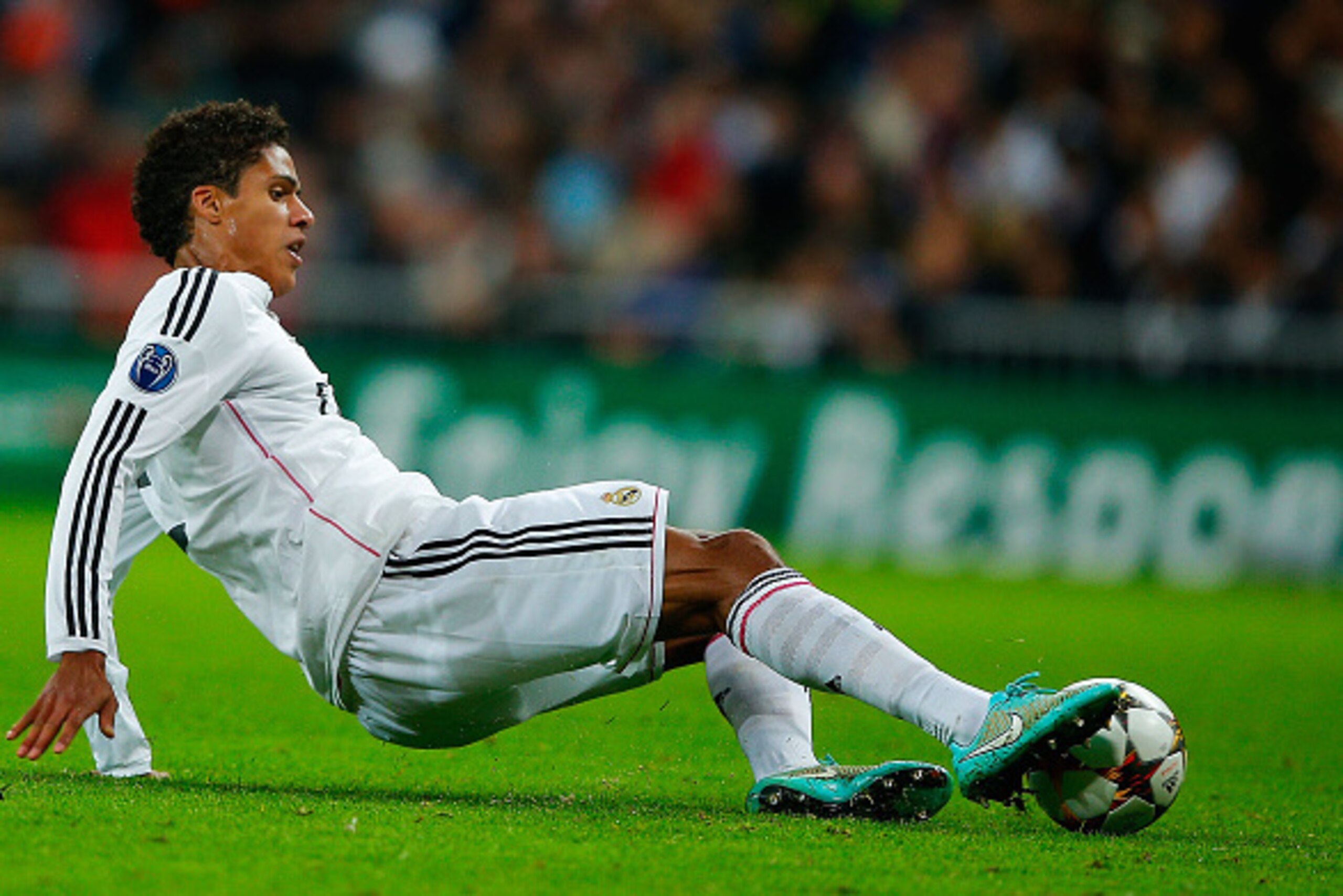 MADRID, SPAIN - NOVEMBER 04: Raphael Varane of Real Madrid CF saves the ball during the UEFA Champions League Group B match between Real Madrid CF and Liverpool FC at Estadio Santiago Bernabeu on November 4, 2014 in Madrid, Spain.  (Photo by Gonzalo Arroy