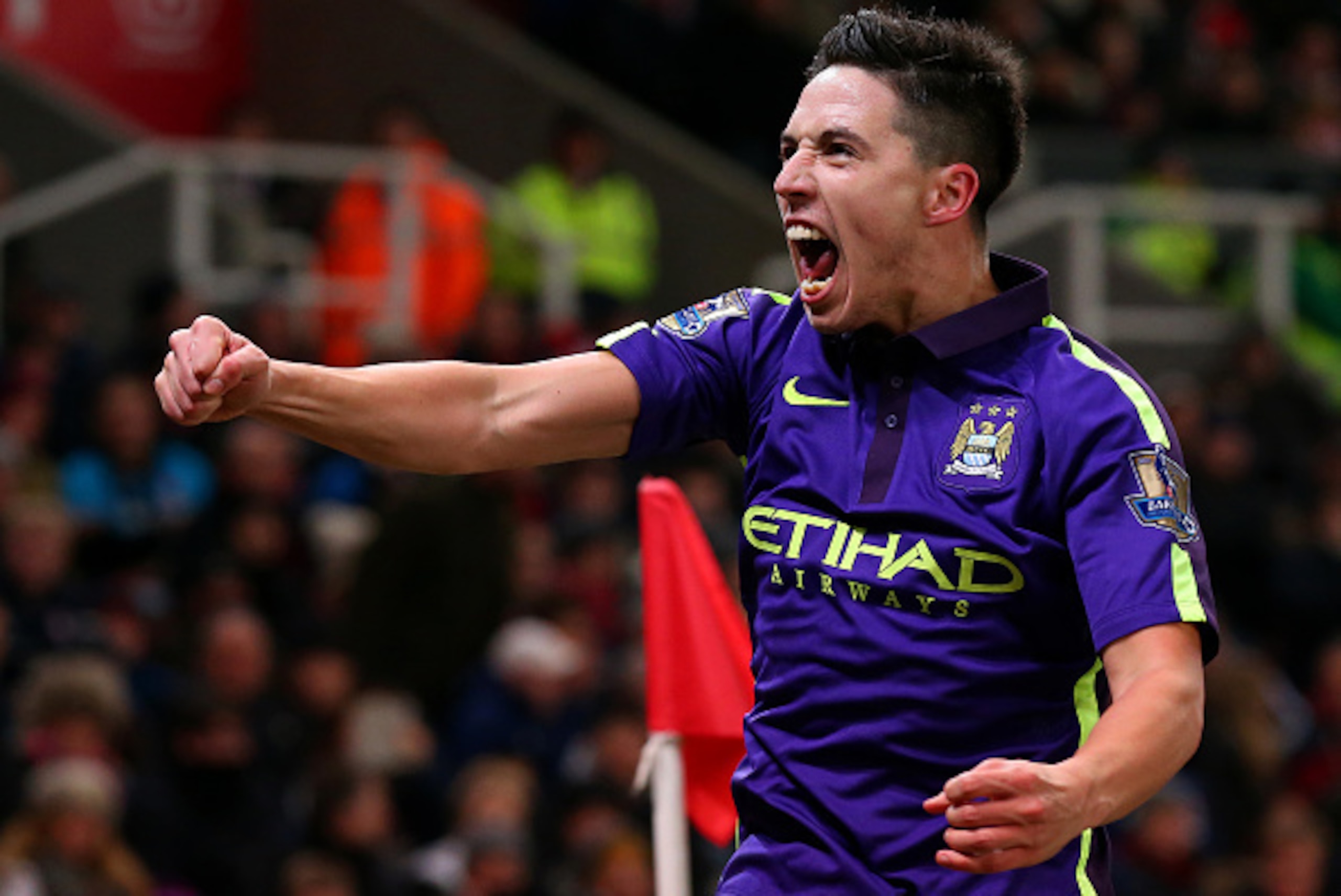 STOKE ON TRENT, ENGLAND - FEBRUARY 11: Samir Nasri of Manchester City celebrates after team-mate James Milner scored their second goal during the Barclays Premier League match between Stoke City and Manchester City at Britannia Stadium on February 11, 20 STOKE ON TRENT, ENGLAND - FEBRUARY 11: Samir Nasri of Manchester City celebrates after team-mate James Milner scored their second goal during the Barclays Premier League match between Stoke City and Manchester City at Britannia Stadium on February 11, 20
