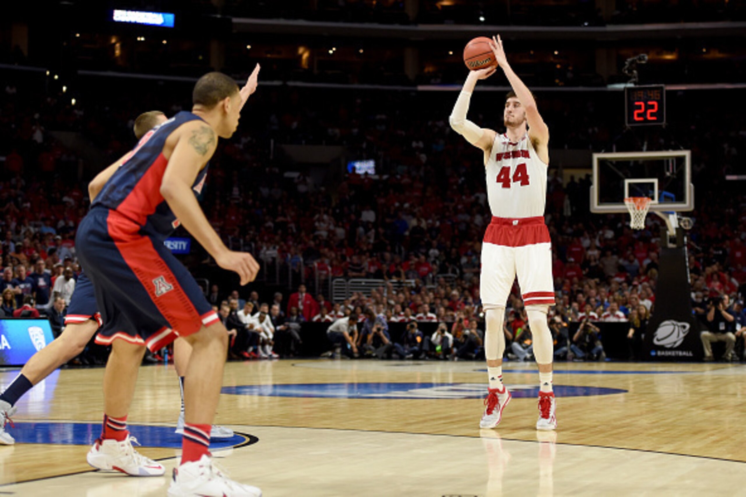 LOS ANGELES, CA - MARCH 28: Frank Kaminsky #44 of the Wisconsin Badgers makes a three-pointer in the second half against the Arizona Wildcats during the West Regional Final of the 2015 NCAA Men's Basketball Tournament at Staples Center on March 28, 2015 LOS ANGELES, CA - MARCH 28: Frank Kaminsky #44 of the Wisconsin Badgers makes a three-pointer in the second half against the Arizona Wildcats during the West Regional Final of the 2015 NCAA Men's Basketball Tournament at Staples Center on March 28, 2015