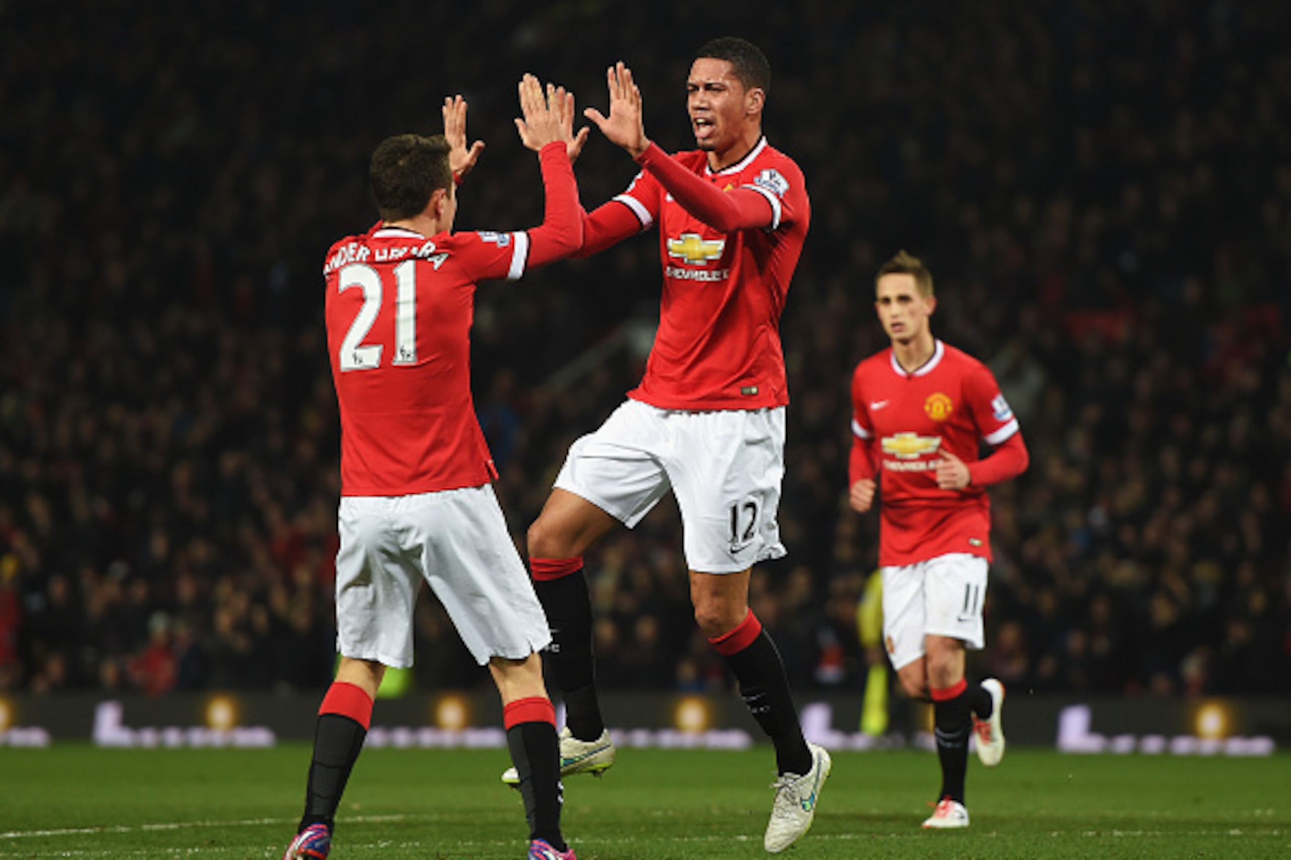 MANCHESTER, ENGLAND - FEBRUARY 11:  Chris Smalling of Manchester United celebrates scoring his second goal during the Barclays Premier League match between Manchester United and Burnley at Old Trafford on February 11, 2015 in Manchester, England.  (Photo 