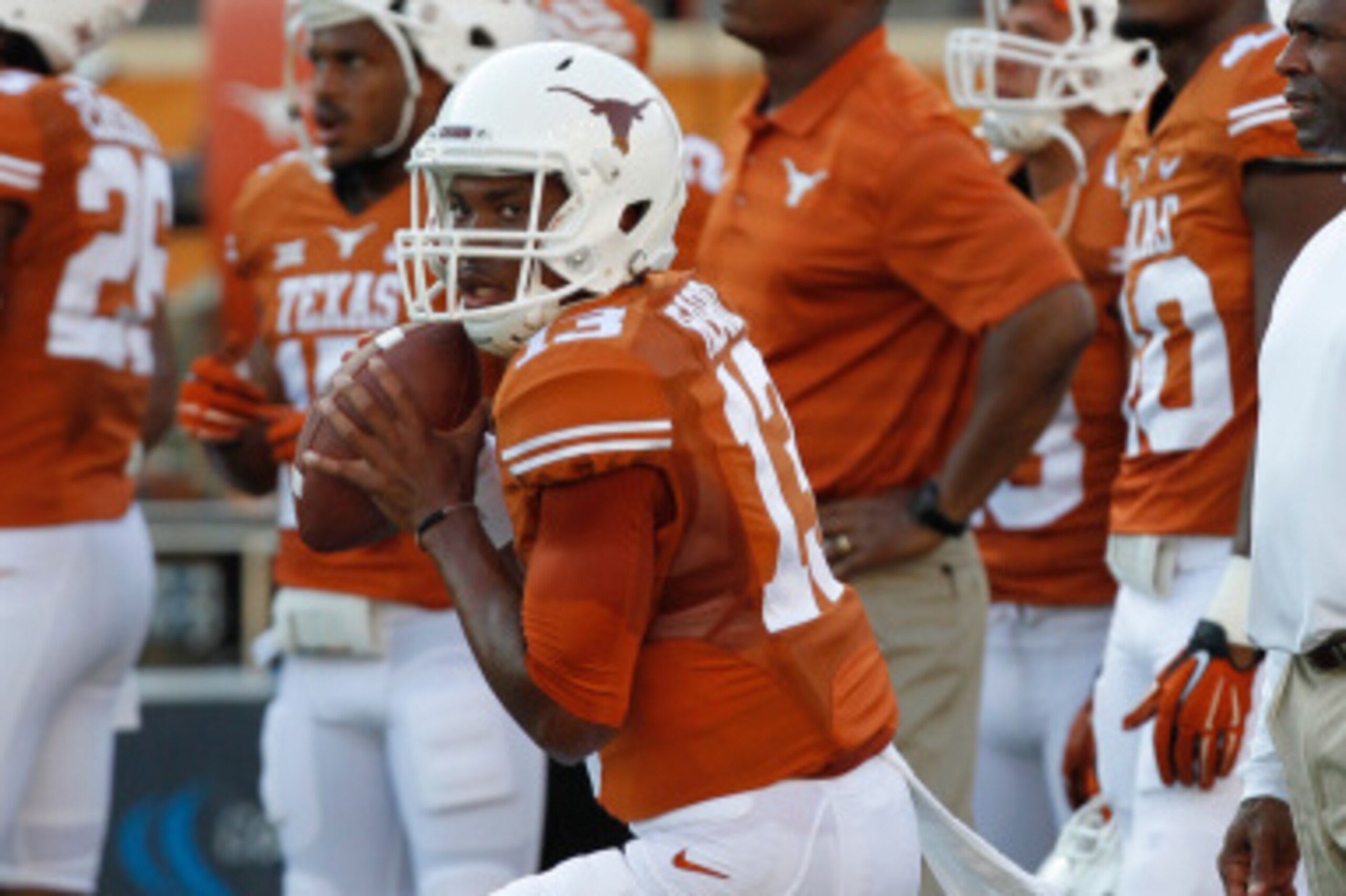 AUSTIN, TX - SEPTEMBER 6: Jerrod Heard #13 of the Texas Longhorns passes during pre game warmups before playing the BYU Cougars on September 6, 2014 at Darrell K Royal-Texas Memorial Stadium in Austin, Texas. (Photo by Chris Covatta/Getty Images)