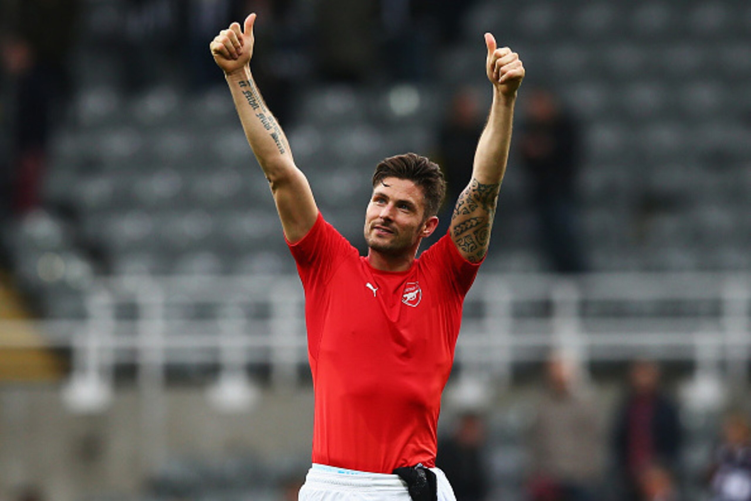 NEWCASTLE UPON TYNE, ENGLAND - MARCH 21:  Olivier Giroud of Arsenal celebrates victory after the Barclays Premier League match between Newcastle United and Arsenal at St James' Park on March 21, 2015 in Newcastle upon Tyne, England.  (Photo by Matthew Lew