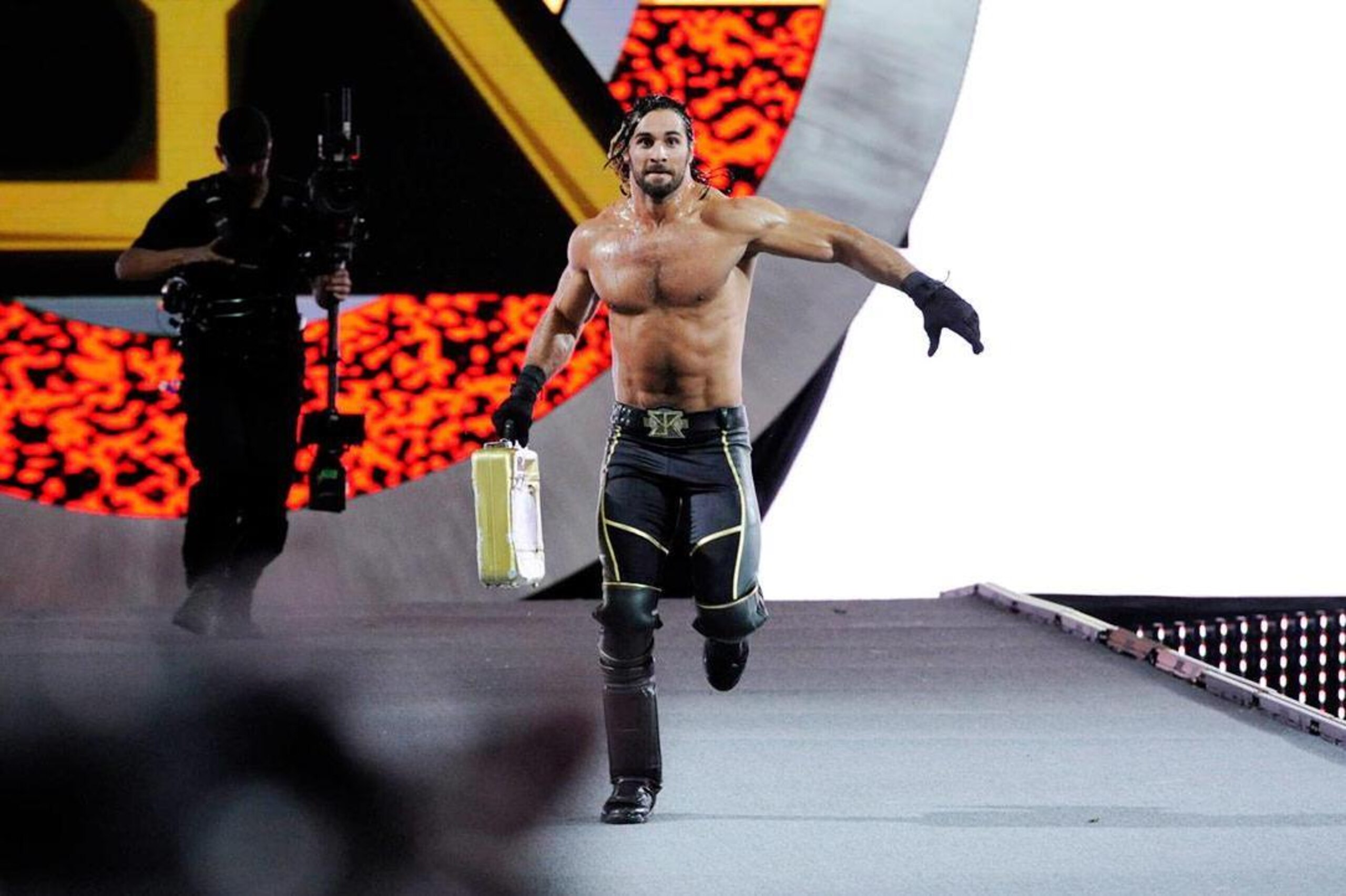 Seth Rollins runs to the ring during the WrestleMania 31 main event.
