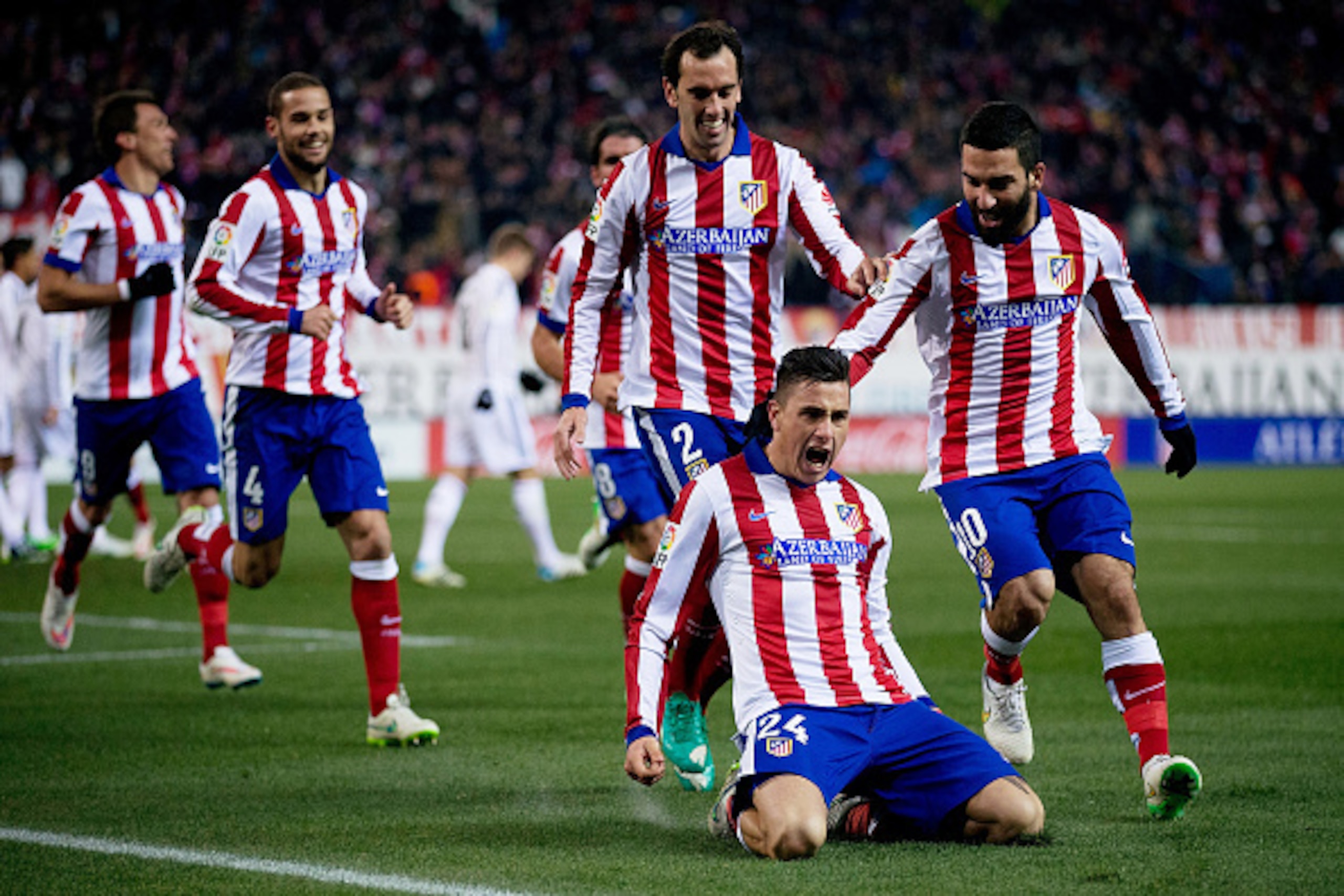 MADRID, SPAIN - JANUARY 07: Jose Maria Gimenez of Atletico de Madrid celebrates scoring their second goal with teammates during the Copa del Rey Round of 16 first leg match between Club Atletico de Madrid and Real Madrid CF at Vicente Calderon Stadium o MADRID, SPAIN - JANUARY 07: Jose Maria Gimenez of Atletico de Madrid celebrates scoring their second goal with teammates during the Copa del Rey Round of 16 first leg match between Club Atletico de Madrid and Real Madrid CF at Vicente Calderon Stadium o