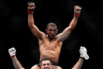 RIO DE JANEIRO, BRAZIL - OCTOBER 25: Jose Aldo of Brazil celebrates after his unanimous-decision victory over Chad Mendes fo the United States in their featherweight championship bout during the UFC 179 event at Maracanazinho on October 25, 2014 in Rio de