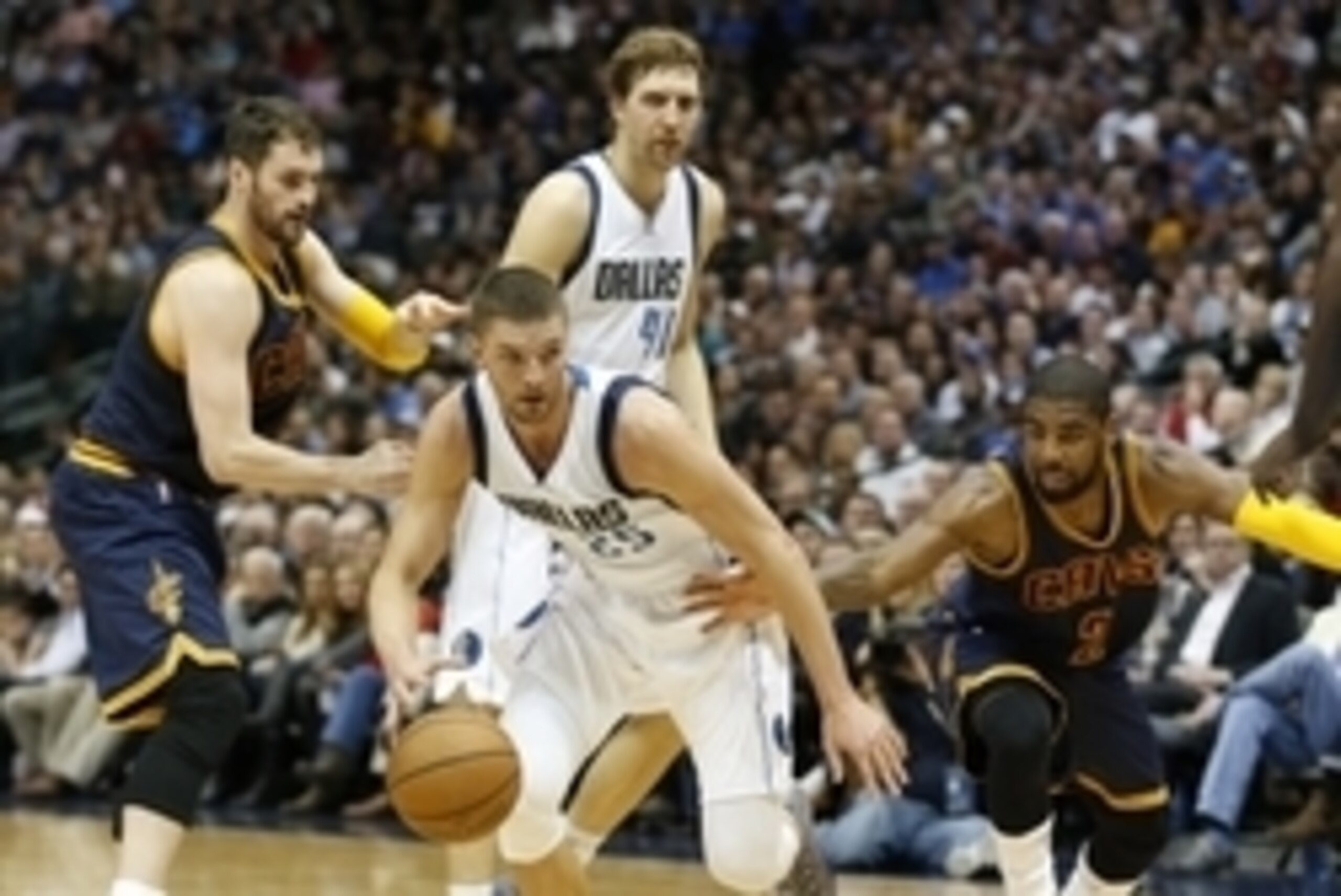 Mar 10, 2015; Dallas, TX, USA; Dallas Mavericks forward Chandler Parsons (25) drives against Cleveland Cavaliers guard Kyrie Irving (2) in the second quarter at American Airlines Center. Mandatory Credit: Matthew Emmons-USA TODAY Sports
