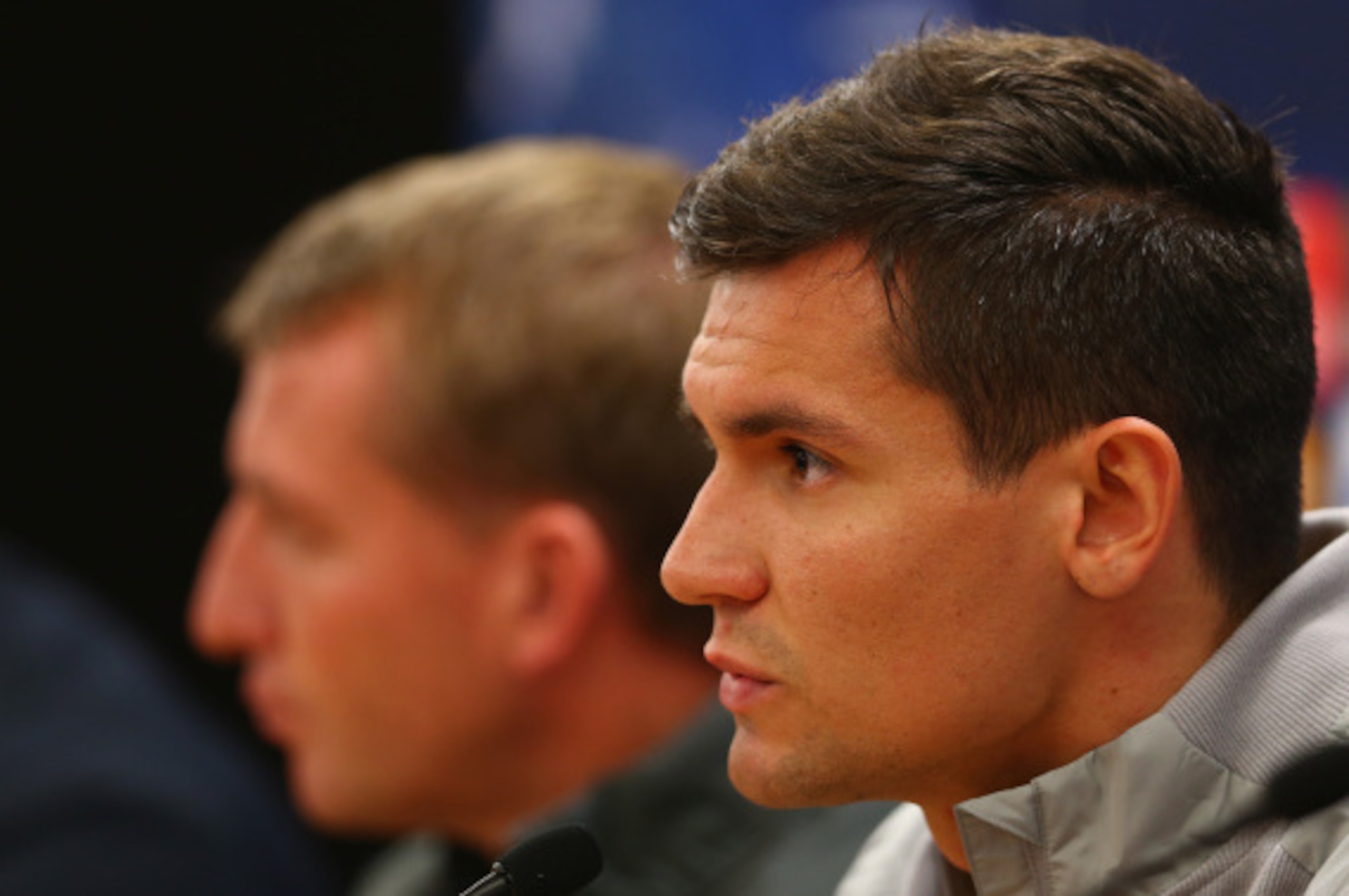 LIVERPOOL, ENGLAND - SEPTEMBER 15: Dejan Lovren of Liverpool answers questions from the media whilst sitting next to his manager Brendan Rodgers during a press conference ahead of their UEFA Champions League group B match against PFC Ludogorets on Septemb