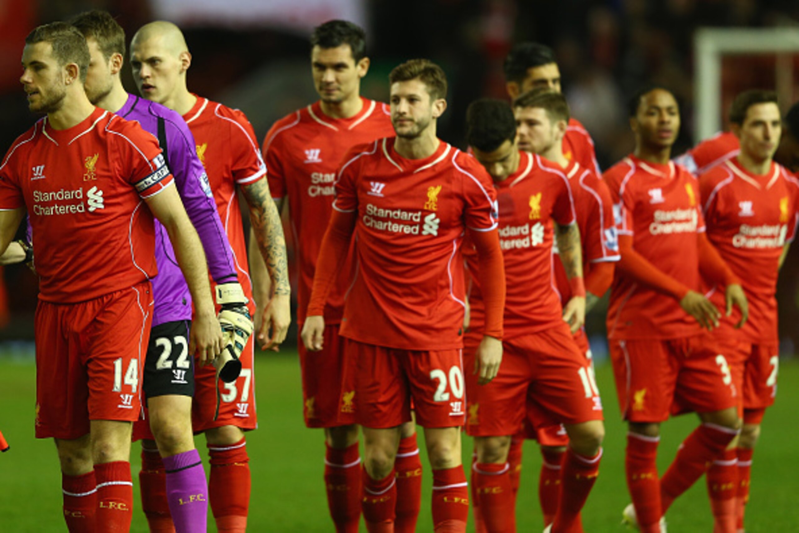 LIVERPOOL, ENGLAND - MARCH 04: Captain Jordan Henderson (L) of Liverpool leads his team ahead of the Barclays Premier League match between Liverpool and Burnley at Anfield on March 4, 2015 in Liverpool, England.  (Photo by Michael Steele/Getty Images)