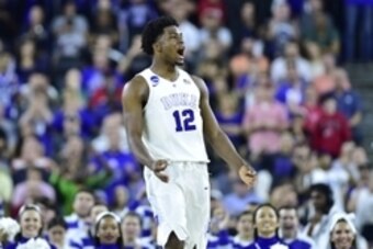 Mar 27, 2015; Houston, TX, USA; Duke Blue Devils forward Justise Winslow (12) celebrates after making a three-point basket against the Utah Utes during the second half in the semifinals of the south regional of the 2015 NCAA Tournament at NRG Stadium. Man