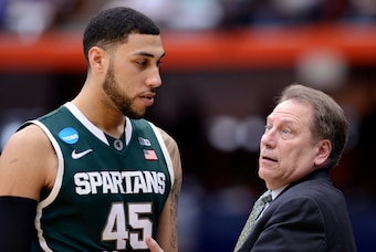 Mar 29, 2015; Syracuse, NY, USA; Michigan State Spartans head coach Tom Izzo talks to Michigan State Spartans guard Denzel Valentine (45) during the second half against the Louisville Cardinals in the finals of the east regional of the 2015 NCAA Tournamen