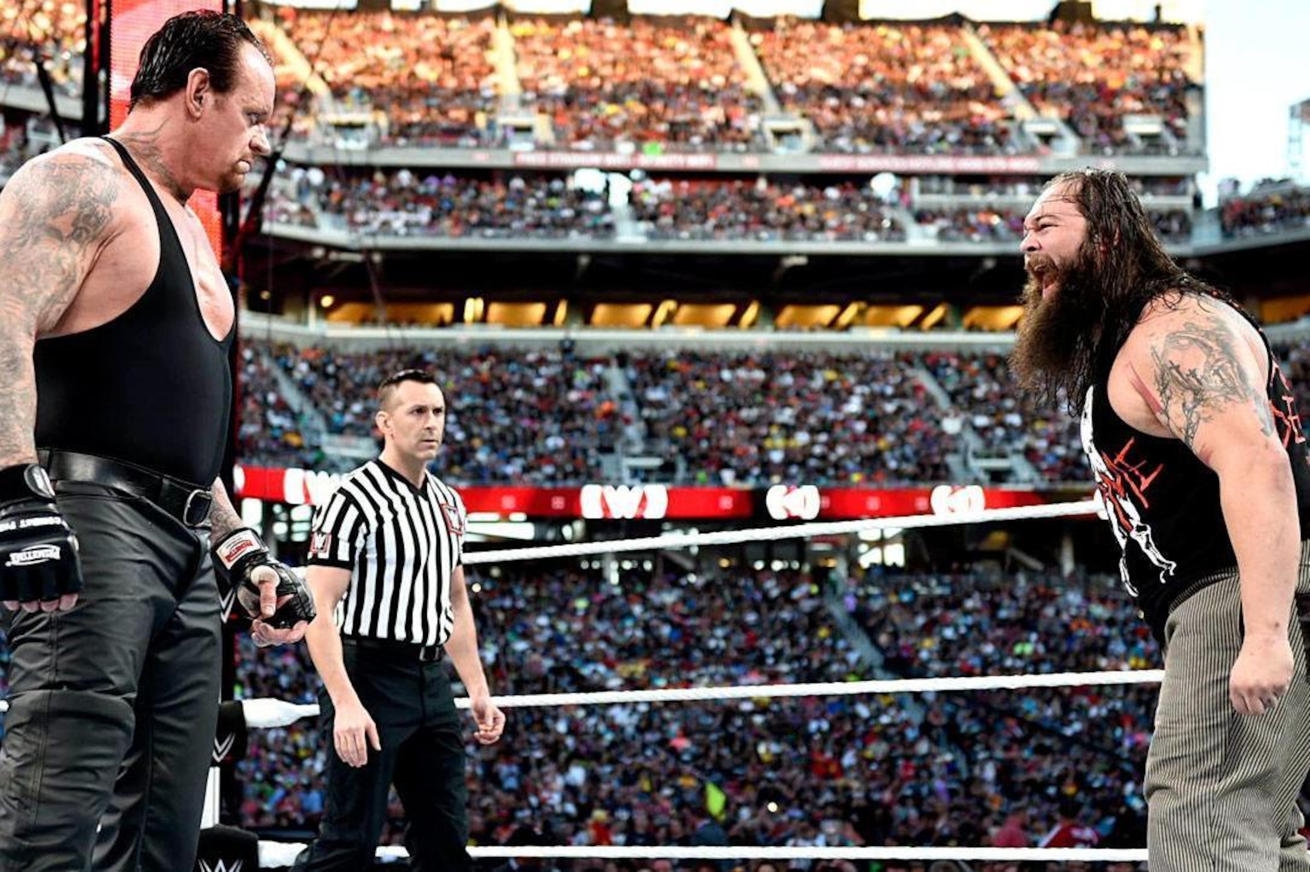 Undertaker stares down Bray WYatt.