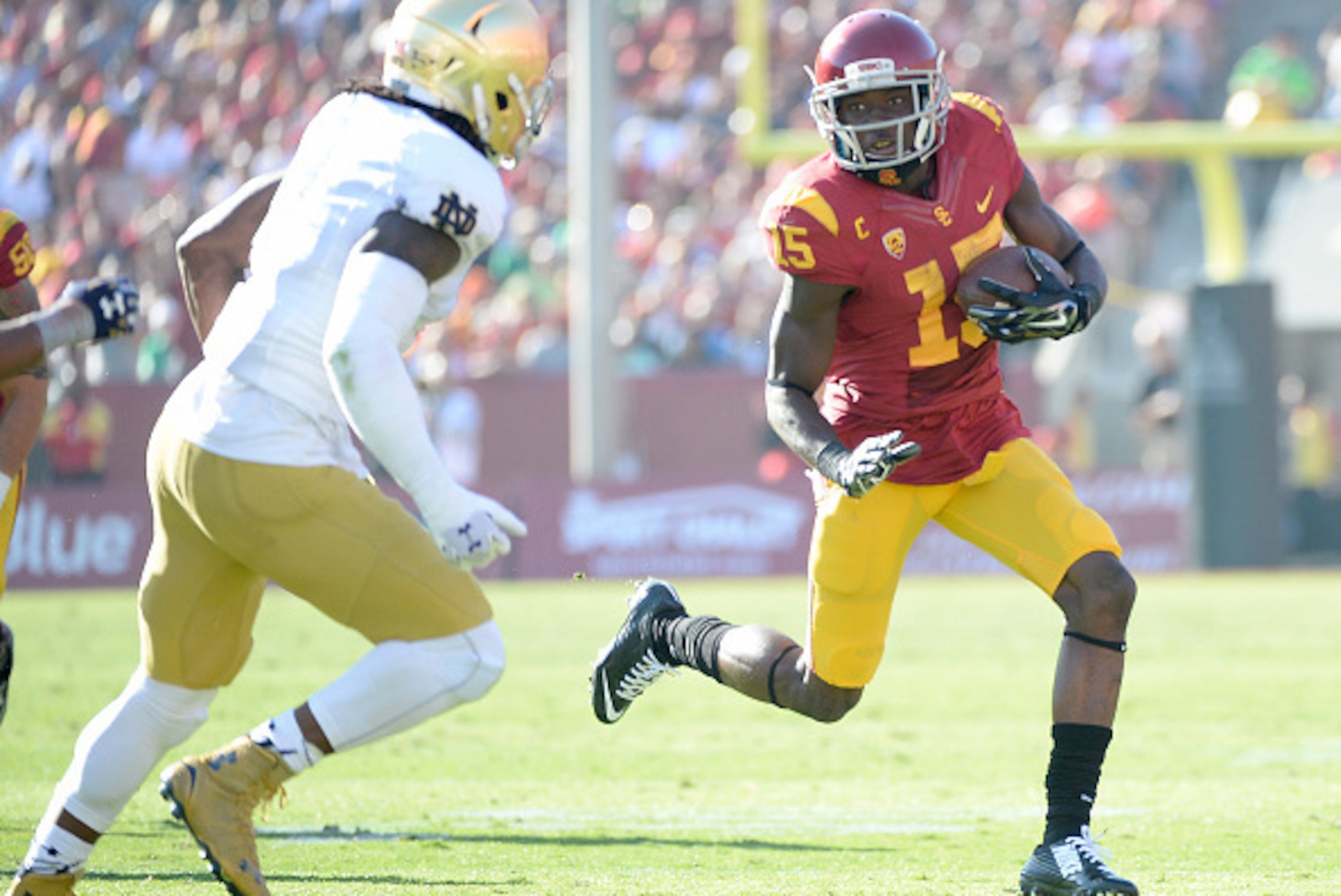 LOS ANGELES, CA - NOVEMBER 29:  Nelson Agholor #15 of the USC Trojans 5at runs after his catch in front of Jaylon Smith #9 of the Notre Dame Fighting Irish Los Angeles Memorial Coliseum on November 29, 2014 in Los Angeles, California.  (Photo by Harry How