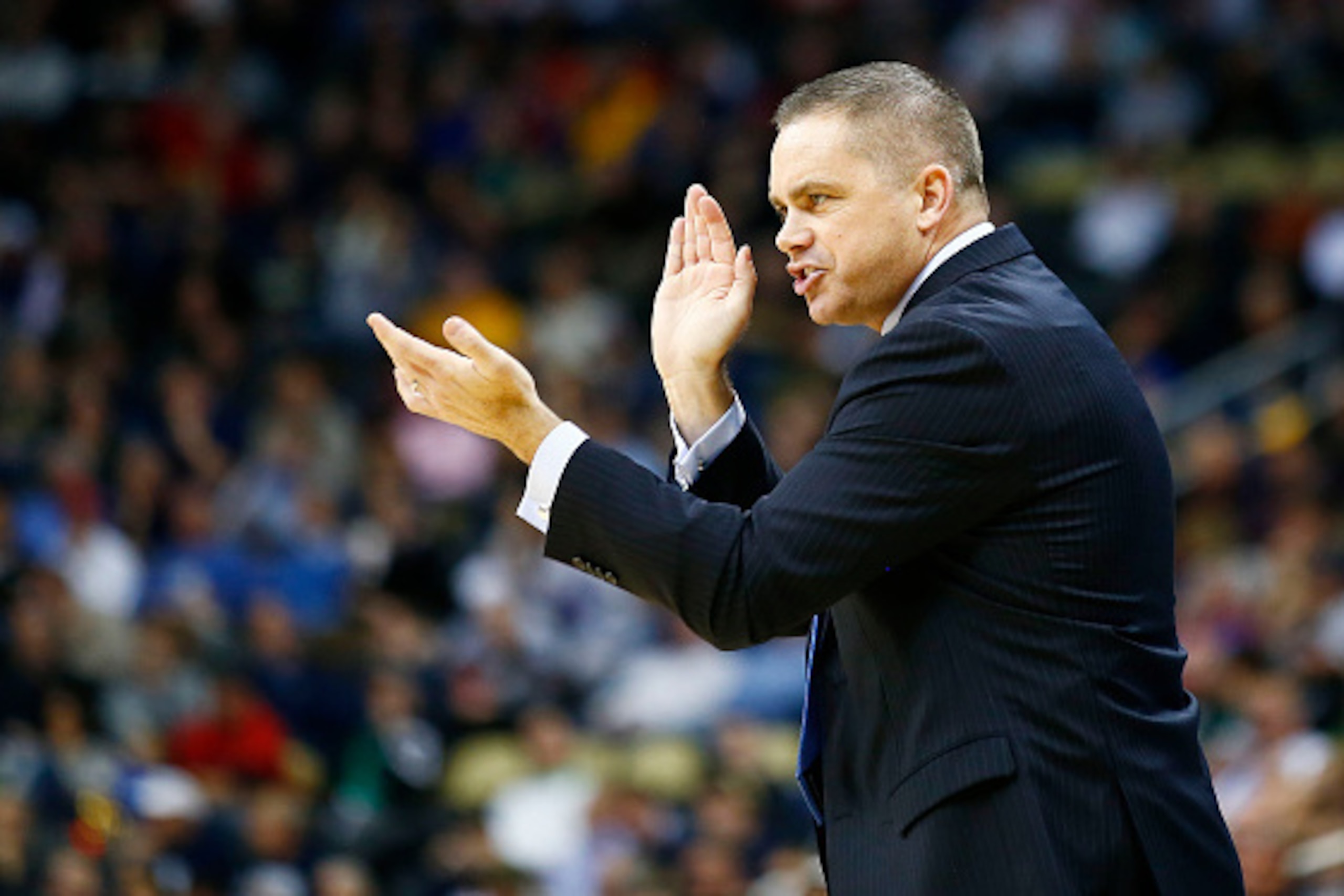 PITTSBURGH, PA - MARCH 19:  Head coach Chris Holtmann of the Butler Bulldogs talks to his team in the second half against the Texas Longhorns during the second round of the 2015 NCAA Men's Basketball Tournament at Consol Energy Center on March 19, 2015 in