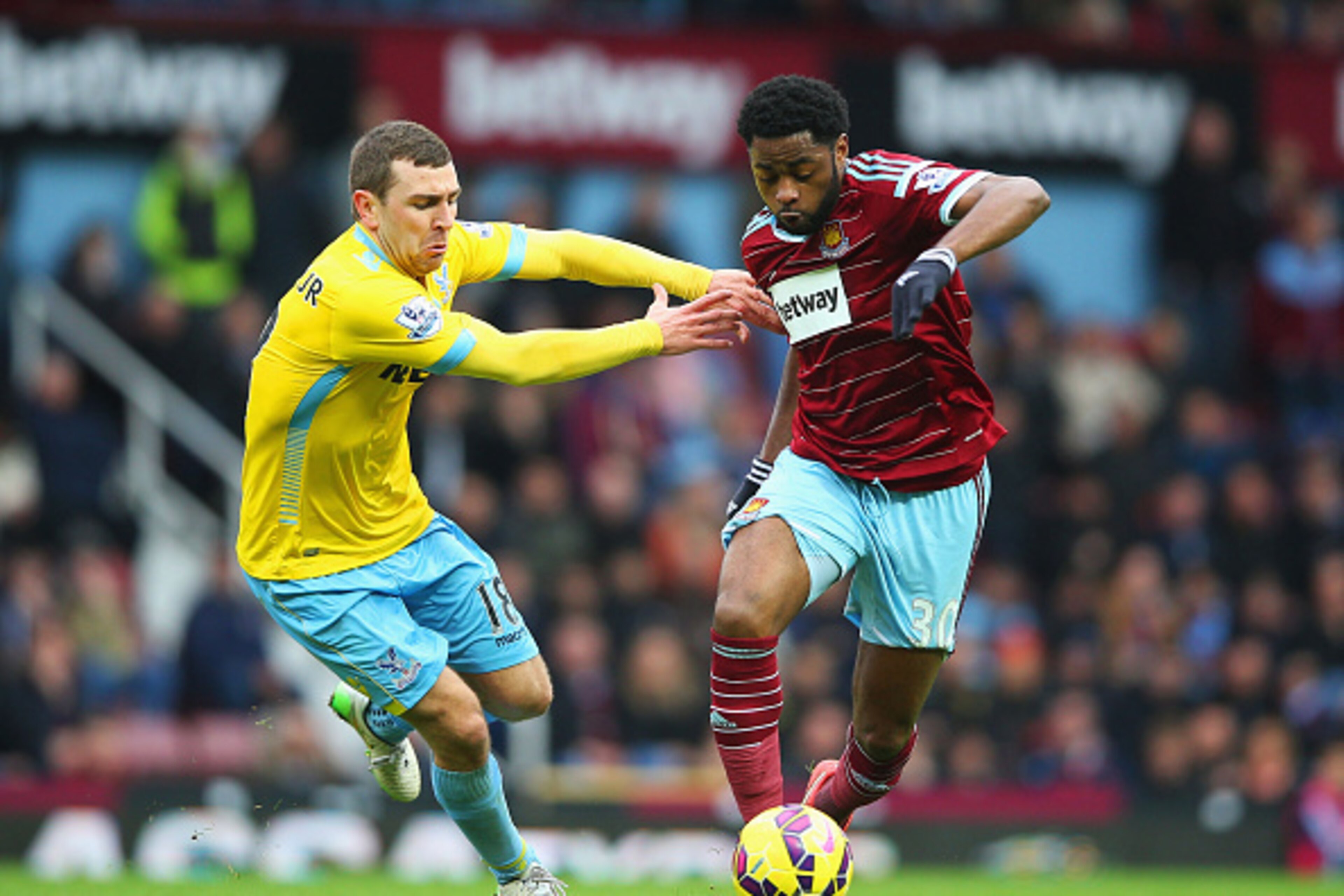 LONDON, ENGLAND - FEBRUARY 28: Alex Song of West Ham United holds off James McArthur of Crystal Palace during the Barclays Premier League match between West Ham United and Crystal Palace at Boleyn Ground on February 28, 2015 in London, England. (Photo b LONDON, ENGLAND - FEBRUARY 28: Alex Song of West Ham United holds off James McArthur of Crystal Palace during the Barclays Premier League match between West Ham United and Crystal Palace at Boleyn Ground on February 28, 2015 in London, England. (Photo b