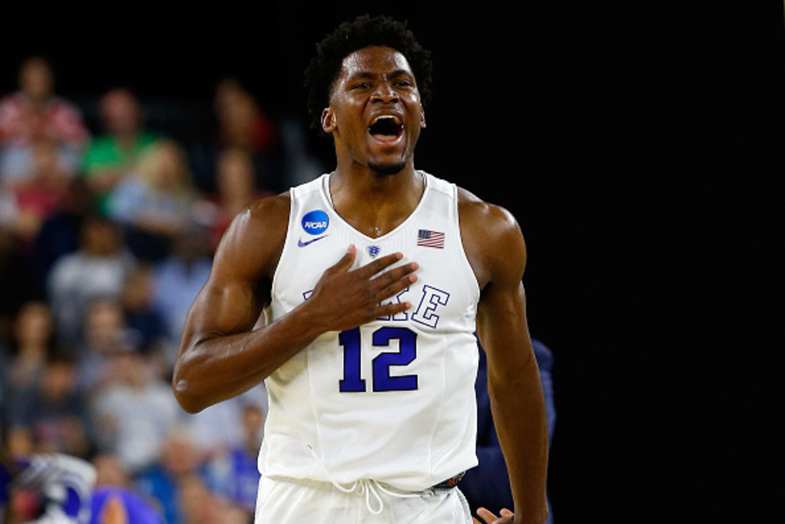 HOUSTON, TX - MARCH 27:  Justise Winslow #12 of the Duke Blue Devils reacts against the Utah Utes during a South Regional Semifinal game of the 2015 NCAA Men's Basketball Tournament at NRG Stadium on March 27, 2015 in Houston, Texas.  (Photo by Tom Pennin