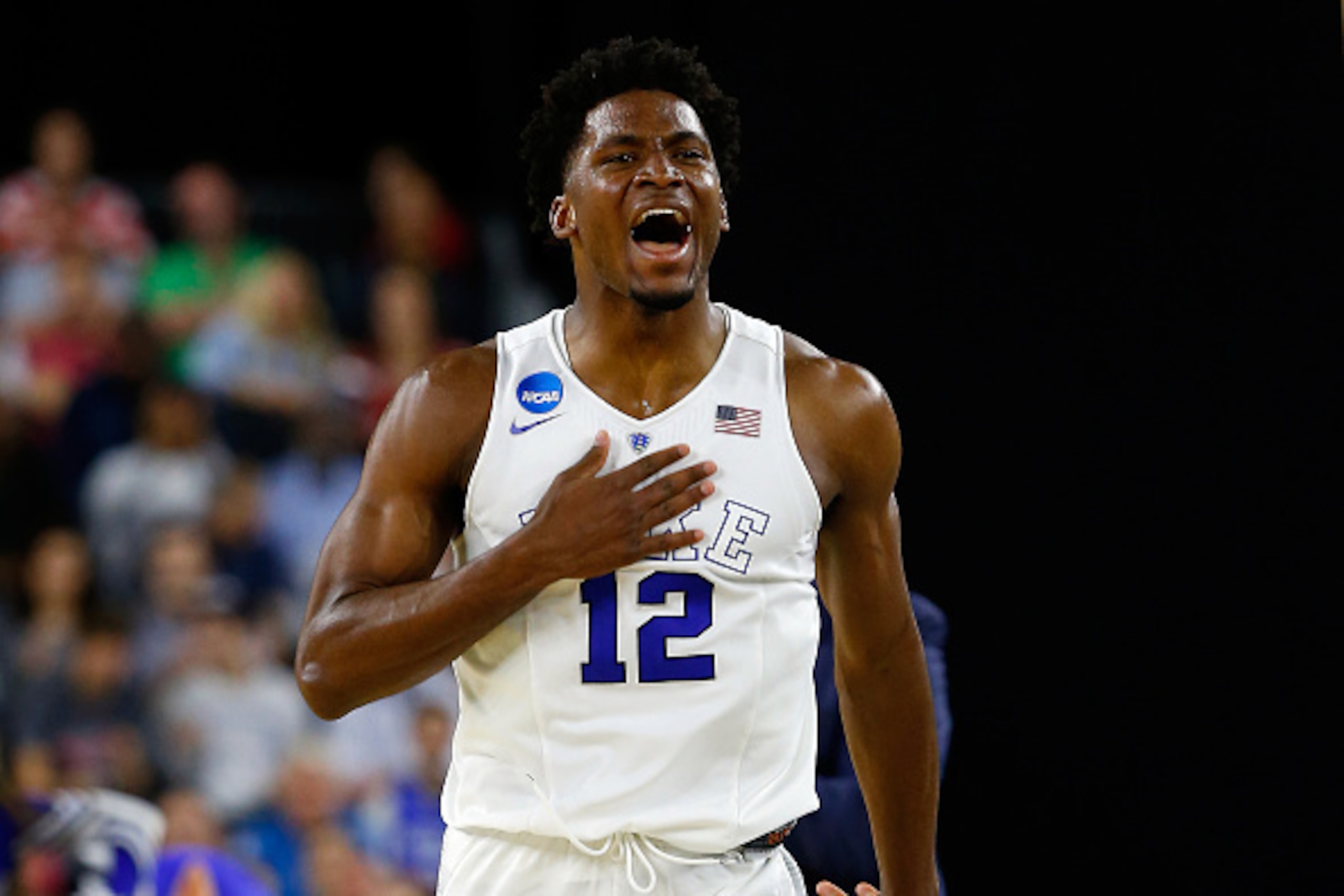 HOUSTON, TX - MARCH 27:  Justise Winslow #12 of the Duke Blue Devils reacts against the Utah Utes during a South Regional Semifinal game of the 2015 NCAA Men's Basketball Tournament at NRG Stadium on March 27, 2015 in Houston, Texas.  (Photo by Tom Pennin