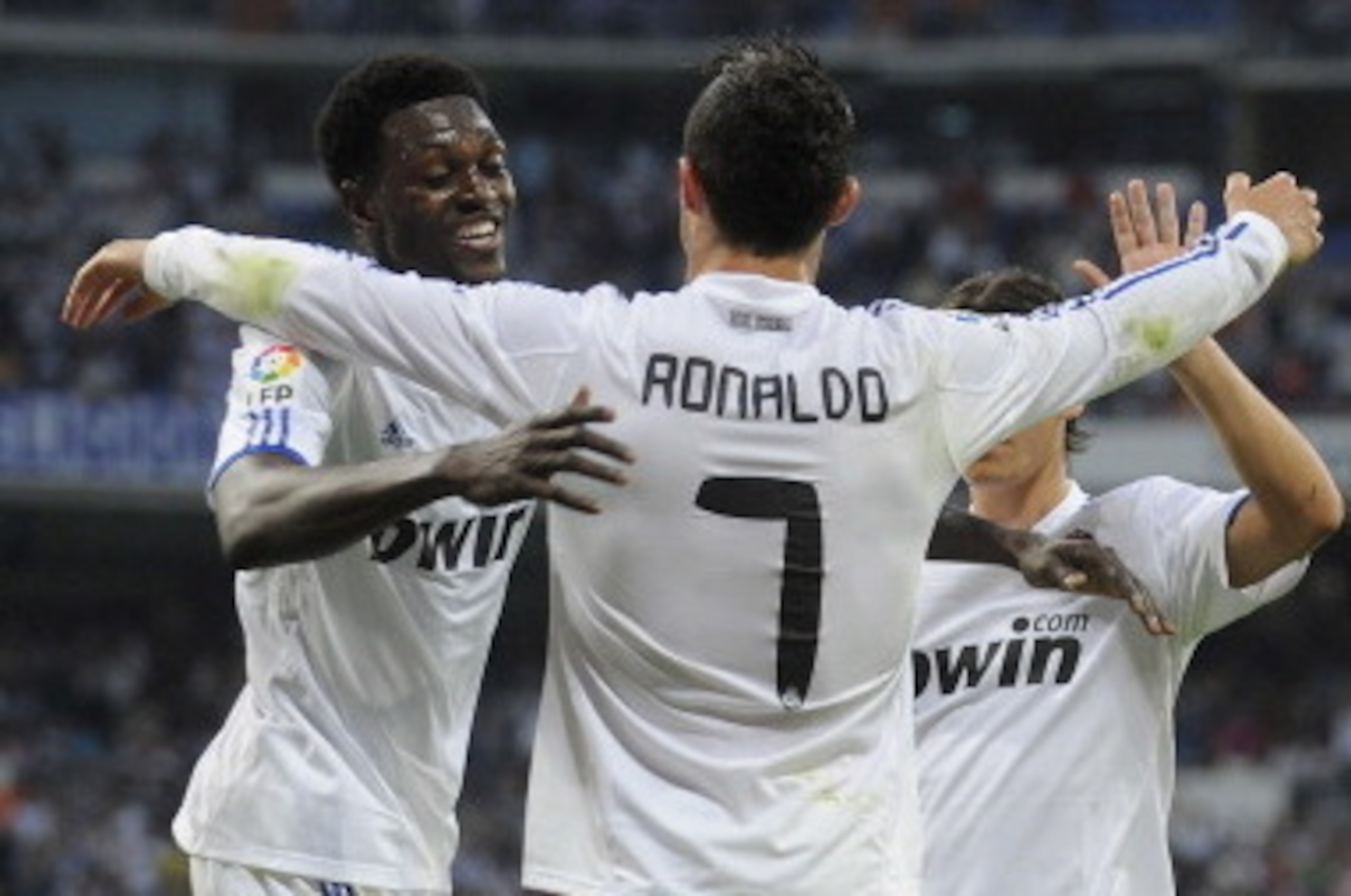 MADRID, SPAIN - MAY 21:  Cristiano Ronaldo of Real Madrid celebrates with  Emmanuel Adebayor after scoring his 2nd goal during the La Liga match between Real Madrid and UD Almeria at Estadio Santiago Bernabeu on May 21, 2011 in Madrid, Spain.  (Photo by D