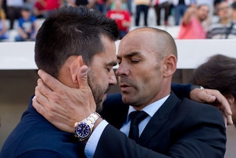 MADRID, SPAIN - MAY 18: Head coach Paco Jemez (R) of Rayo Vallecano de Madrid embraces head coach Cosmin Contra (L) of Getafe CF during the La Liga match between Rayo Vallecano de Madrid and Getafe CF at Estadio de Vallecas on May 18, 2014 in Madrid, Spai