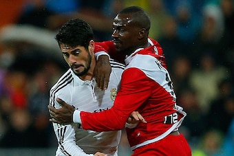 MADRID, SPAIN - NOVEMBER 08: Francisco Roman Alarcon alias Isco (L) of Real Madrid CF competes for the ball with Gael Kakuta (R) of Rayo Vallecano de Madrid during the La Liga match between Real Madrid CF and Rayo Vallecano de Madrid at Estadio Santiago B