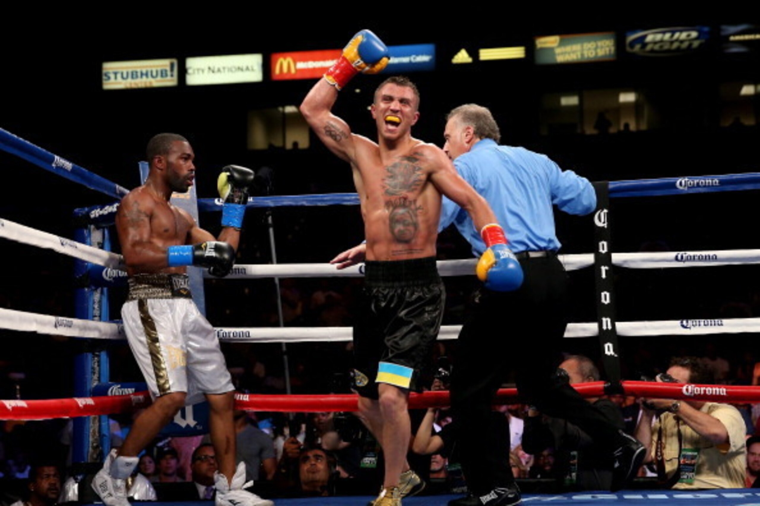 LOS ANGELES, CA - JUNE 21:  Vasyl Lomachenko celebrates after the final bell against Gary Russell Jr. in their WBO Featherwieight Title bout at StubHub Center on June 21, 2014 in Los Angeles, California.  Lomachenko won by split decision.  (Photo by Steph
