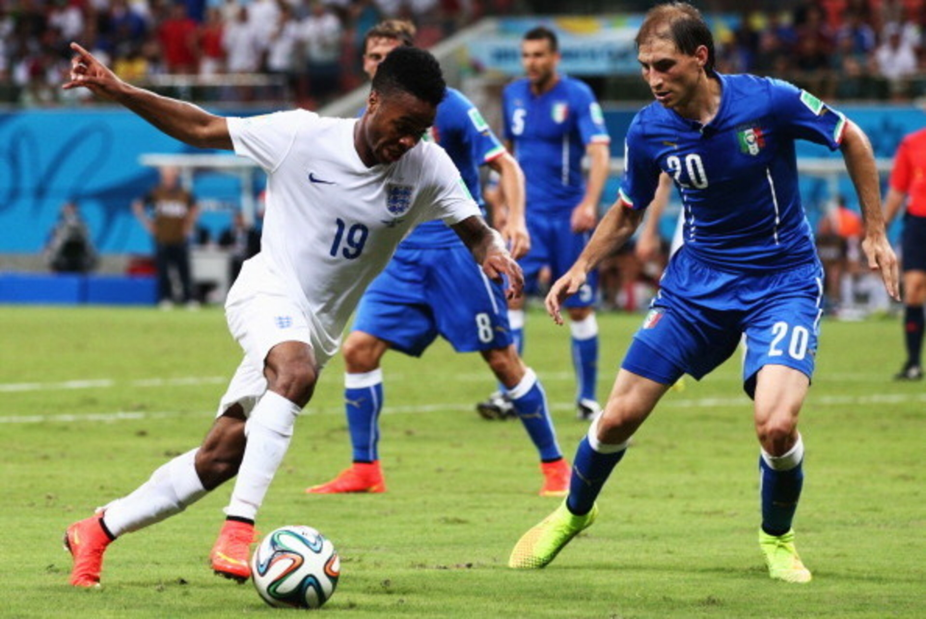 MANAUS, BRAZIL - JUNE 14:  Raheem Sterling of England takes on Gabriel Paletta of Italy during the 2014 FIFA World Cup Brazil Group D match between England and Italy at Arena Amazonia on June 14, 2014 in Manaus, Brazil.  (Photo by Adam Pretty/Getty Images