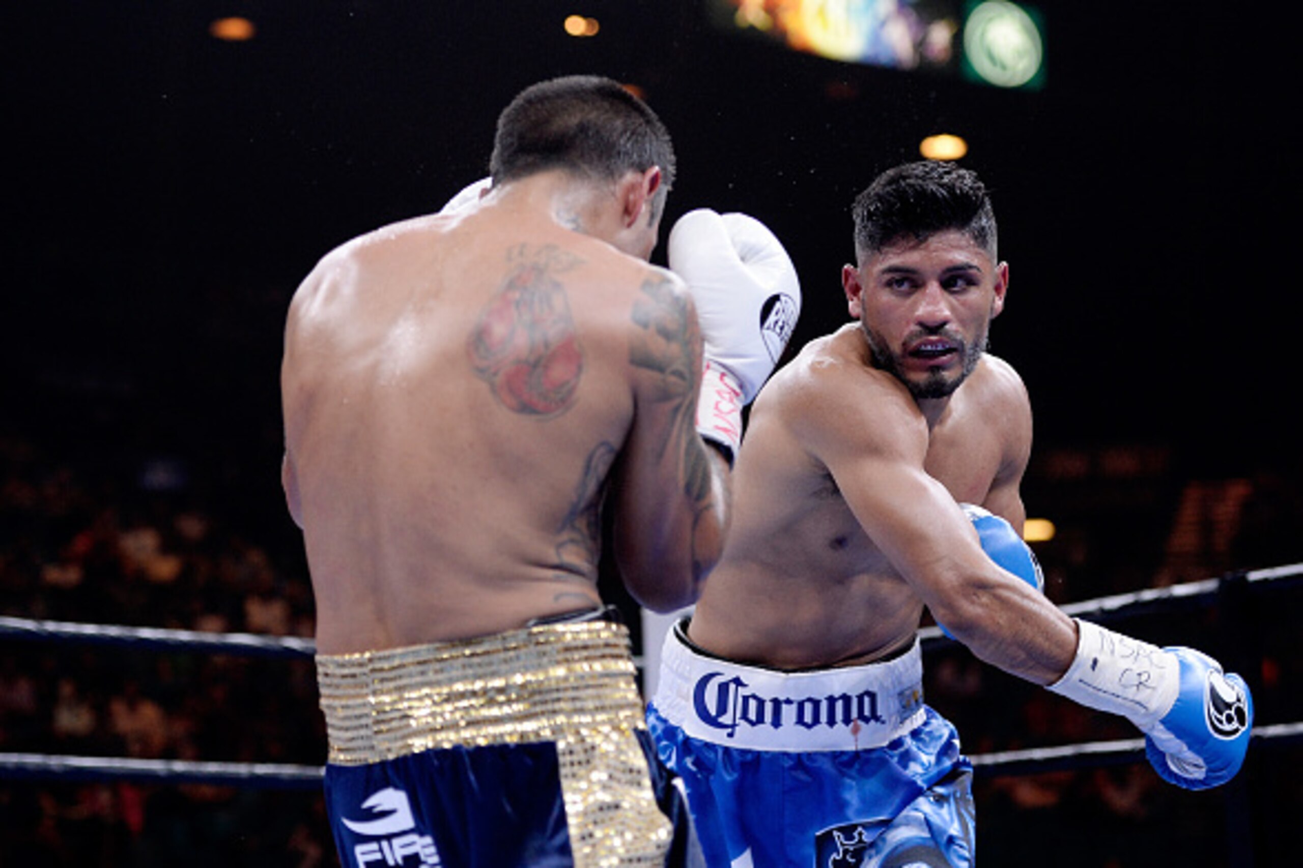 LAS VEGAS, NV - MARCH 07:  Abner Mares (light blue trunks) fights Arturo S. Reyes (dark blue trunks) during a Premier Boxing Champions bout in the MGM Grand Garden Arena on March 7, 2015 in Las Vegas, Nevada.  (Photo by Harry How/Getty Images)