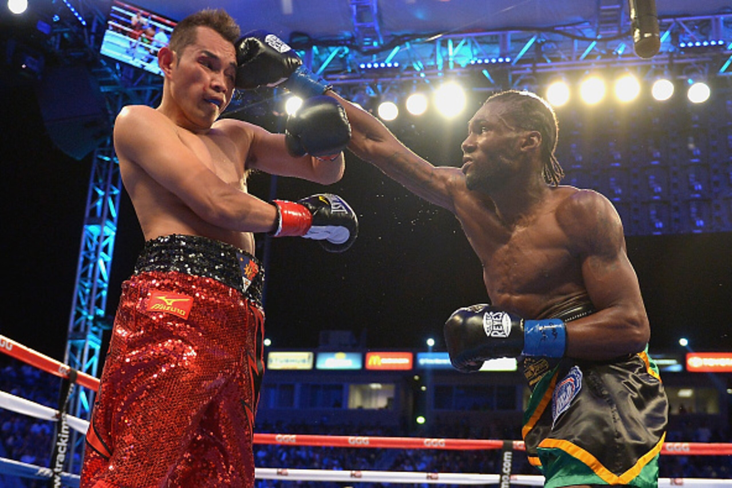 LOS ANGELES, CA - OCTOBER 18:  Nicholas Walters of Jamaica Nonito Donaire throws a punch against Nonito Donaire during the WBA 'Super' Featherweight Title bout at StubHub Center on October 18, 2014 in Los Angeles, California.  (Photo by Jonathan Moore/Get