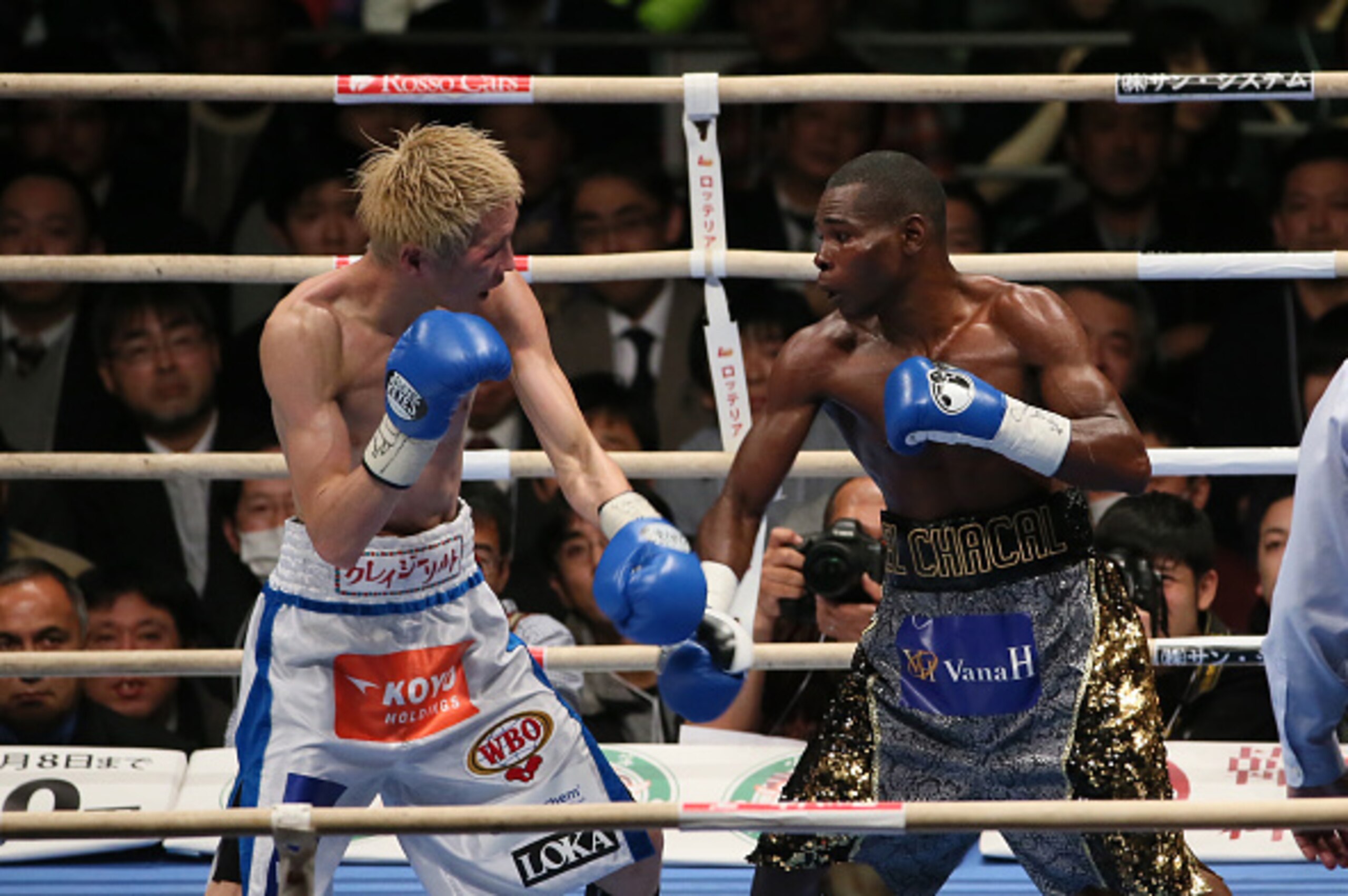 OSAKA, JAPAN - DECEMBER 31:  Hisashi Amagasa of Japan (L) and Guillermo Rigondeaux of Cuba exchange punches during the WBA/WBO world super bantamweight bout between Guillermo Rigondeaux of Cuba and Hisashi Amagasa of Japan at Bodymaker Colosseum on Decemb