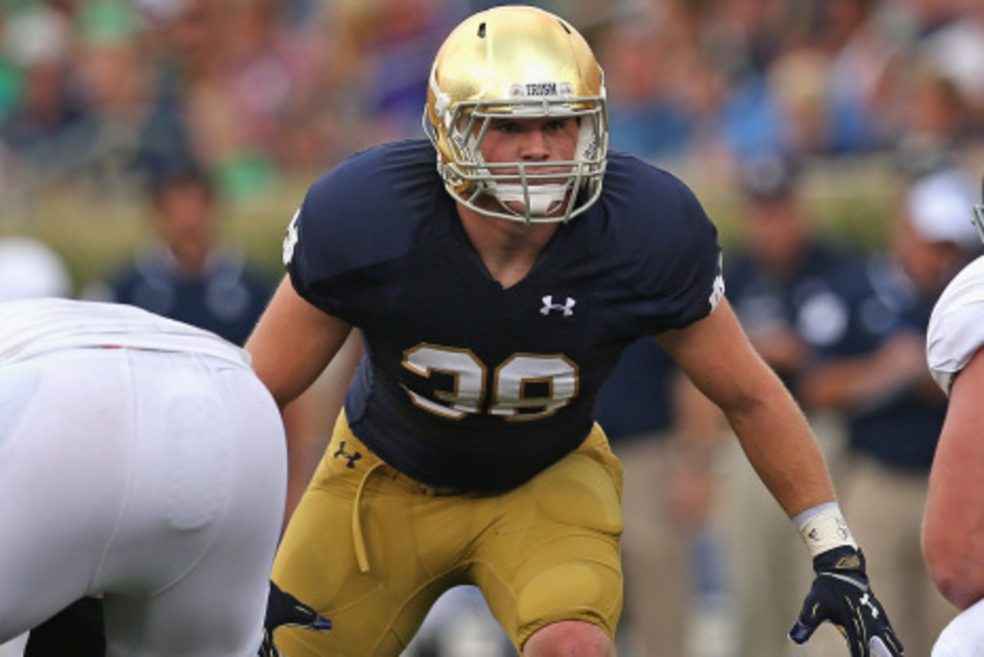 SOUTH BEND, IN - AUGUST 30: Joe Schmidt #38 of the Norte Dame Fighting Irish awaits the snap against the Rice Owls at Notre Dame Stadium on August 30, 2014 in South Bend, Indiana. Notre Dame defeated Rice 48-17.  (Photo by Jonathan Daniel/Getty Images)