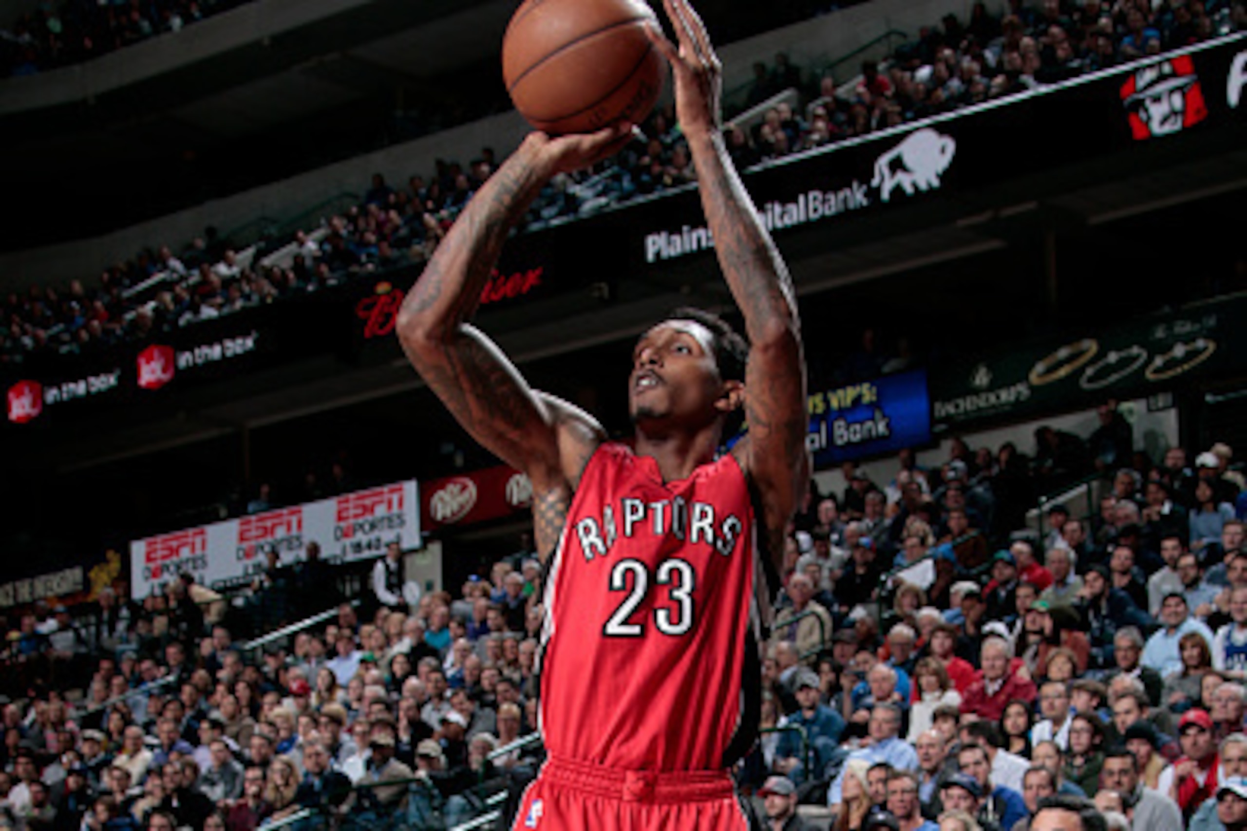 DALLAS, TX - FEBRUARY 24: Lou Williams #23 of the Toronto Raptors shoots against the Dallas Mavericks on February 24, 2015 at the American Airlines Center in Dallas, Texas. NOTE TO USER: User expressly acknowledges and agrees that, by downloading and or u