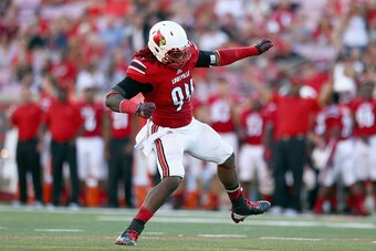 LOUISVILLE, KY - SEPTEMBER 27:  Lorenzo Mauldin #94 of the Louisville Cardinals celebrates after sacking the quarterback during the game against the Wake Forest Demon Deacons at Papa John's Cardinal Stadium on September 27, 2014 in Louisville, Kentucky.  
