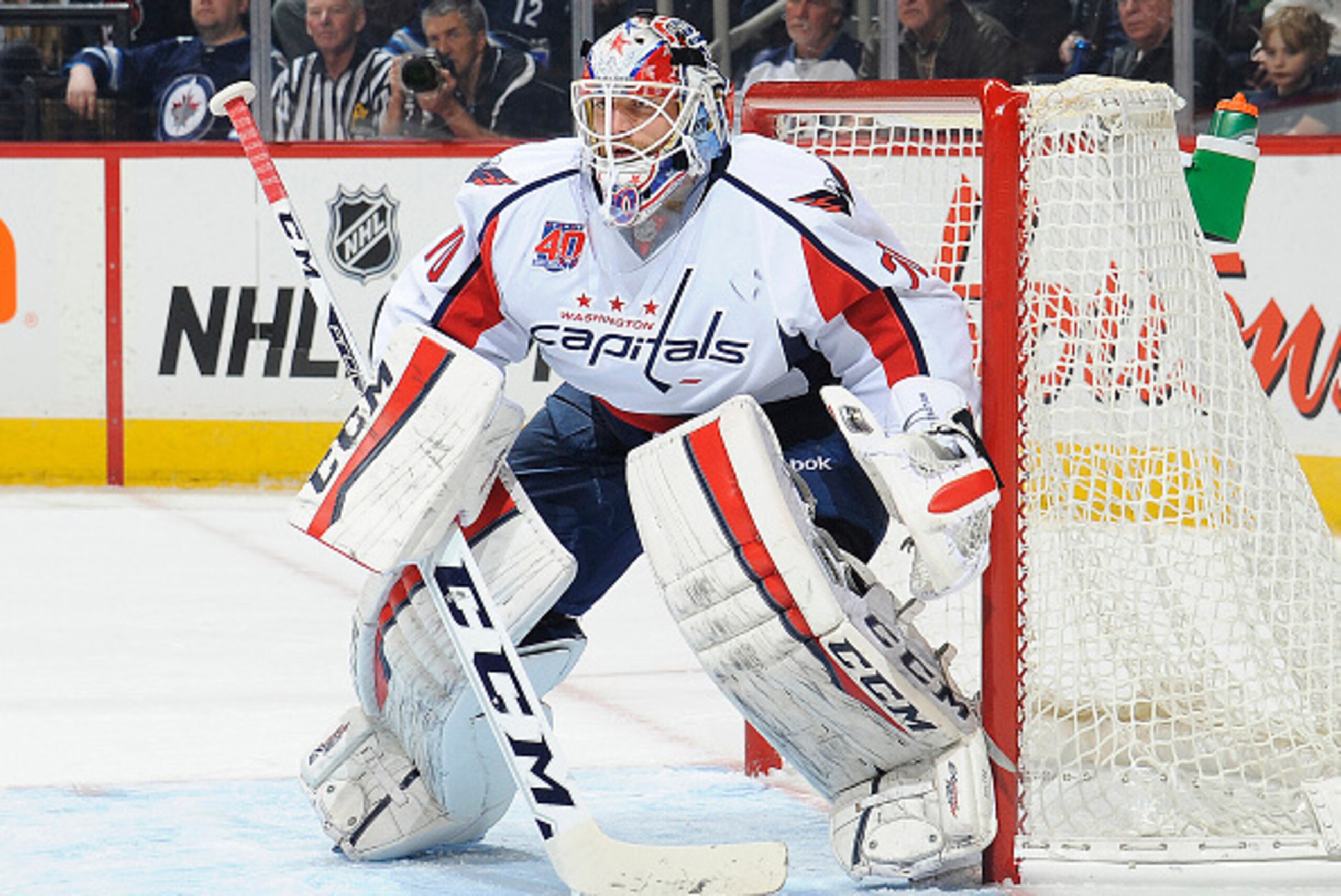 WINNIPEG, CANADA - MARCH 21: Goaltender Braden Holtby #70 of the Washington Capitals guards the net during first period action against the Winnipeg Jets on March 21, 2015 at the MTS Centre in Winnipeg, Manitoba, Canada. The Jets defeated the Caps 3-0. (Ph