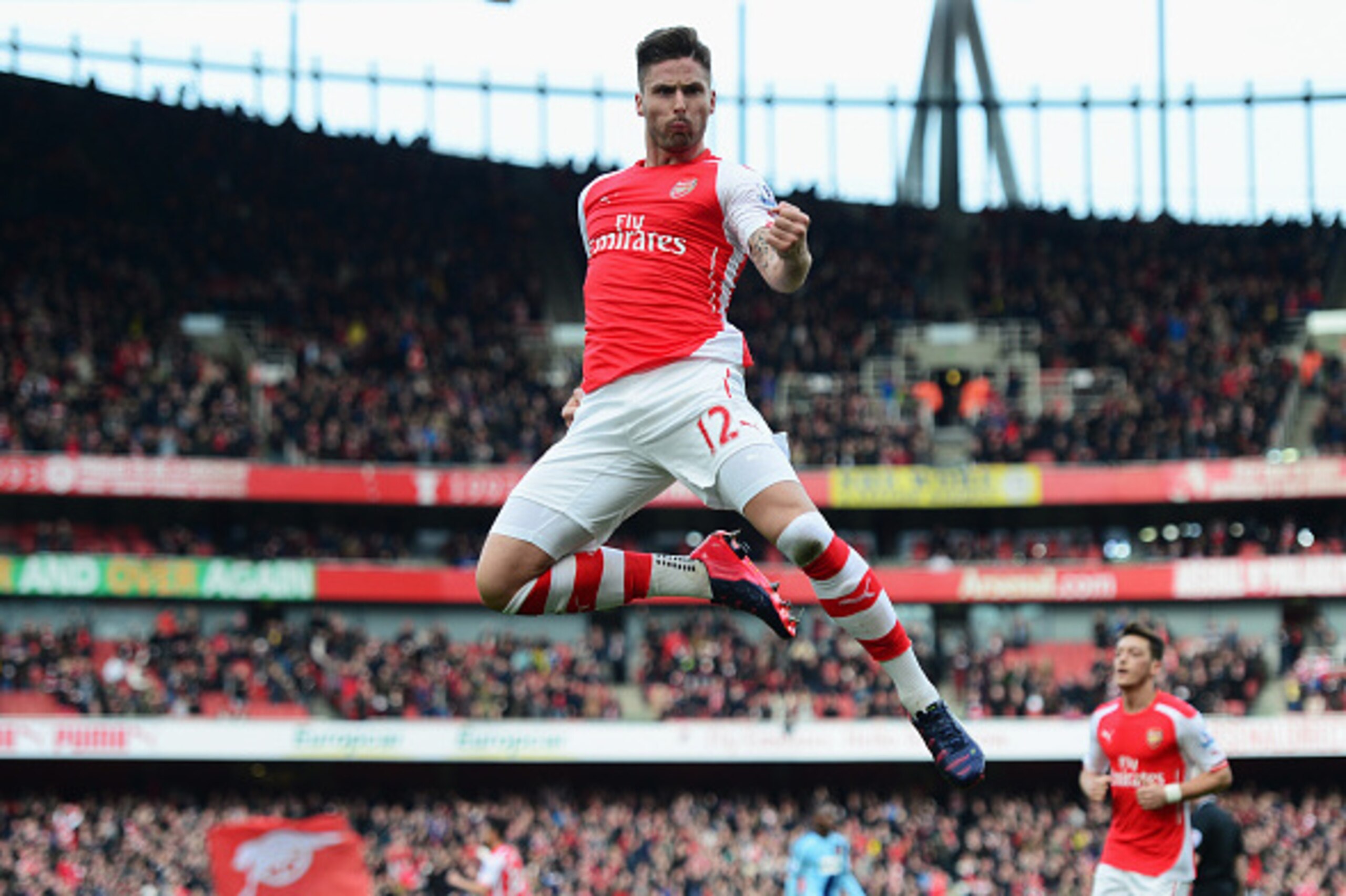 LONDON, ENGLAND - MARCH 14:  Olivier Giroud of Arsenal celebrates scoring the opening goal during the Barclays Premier League match between Arsenal and West Ham United at Emirates Stadium on March 14, 2015 in London, England.  (Photo by Jamie McDonald/Get