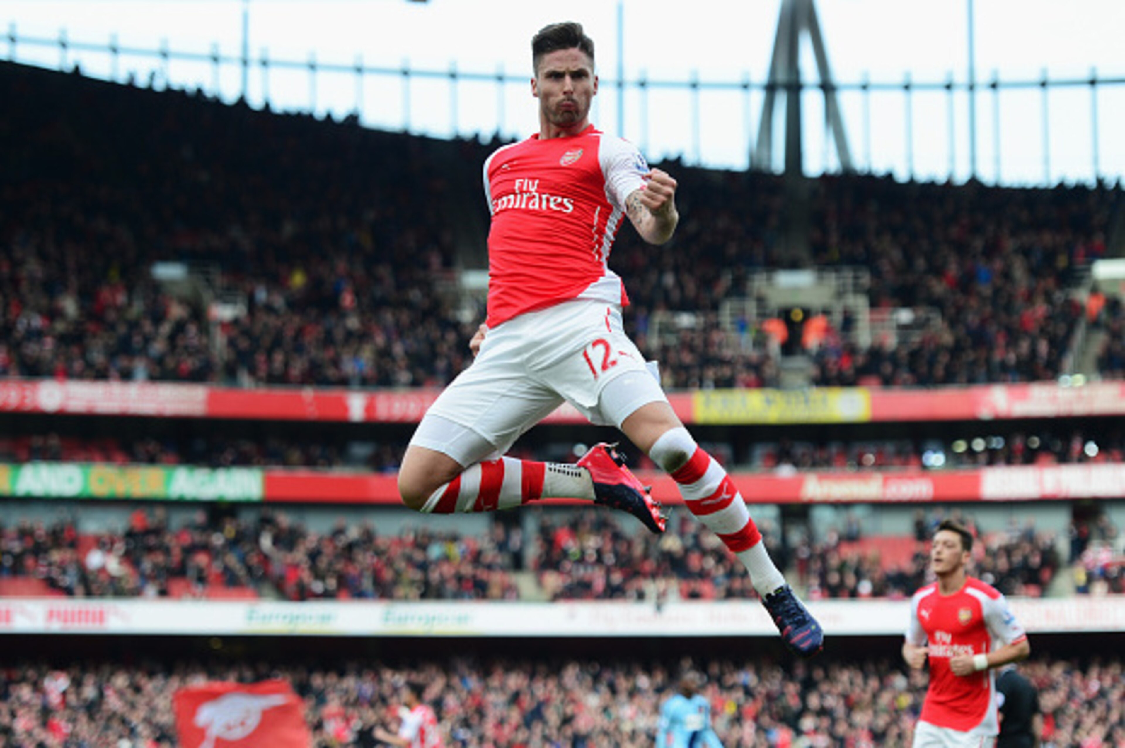 LONDON, ENGLAND - MARCH 14:  Olivier Giroud of Arsenal celebrates scoring the opening goal during the Barclays Premier League match between Arsenal and West Ham United at Emirates Stadium on March 14, 2015 in London, England.  (Photo by Jamie McDonald/Get