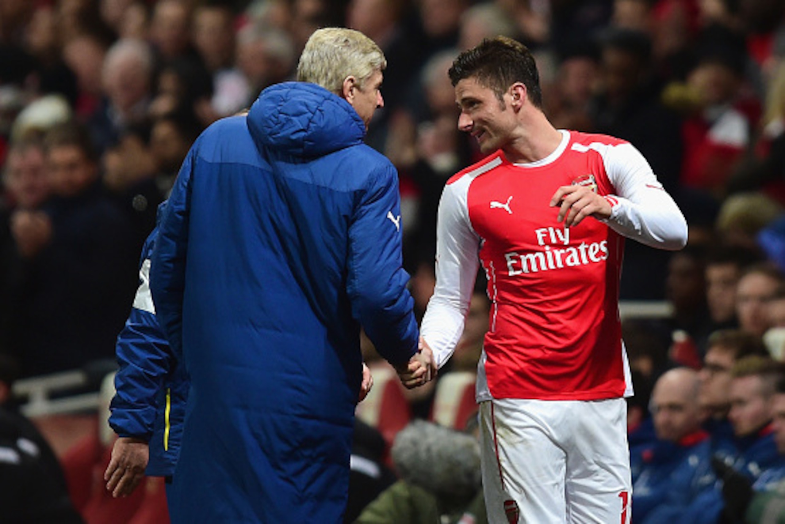 LONDON, ENGLAND - FEBRUARY 15: Arsene Wenger, manager of Arsenal shakes hands with Olivier Giroud of Arsenal during the FA Cup fifth round match between Arsenal and Middlesbrough at Emirates Stadium on February 15, 2015 in London, England.  (Photo by Jami