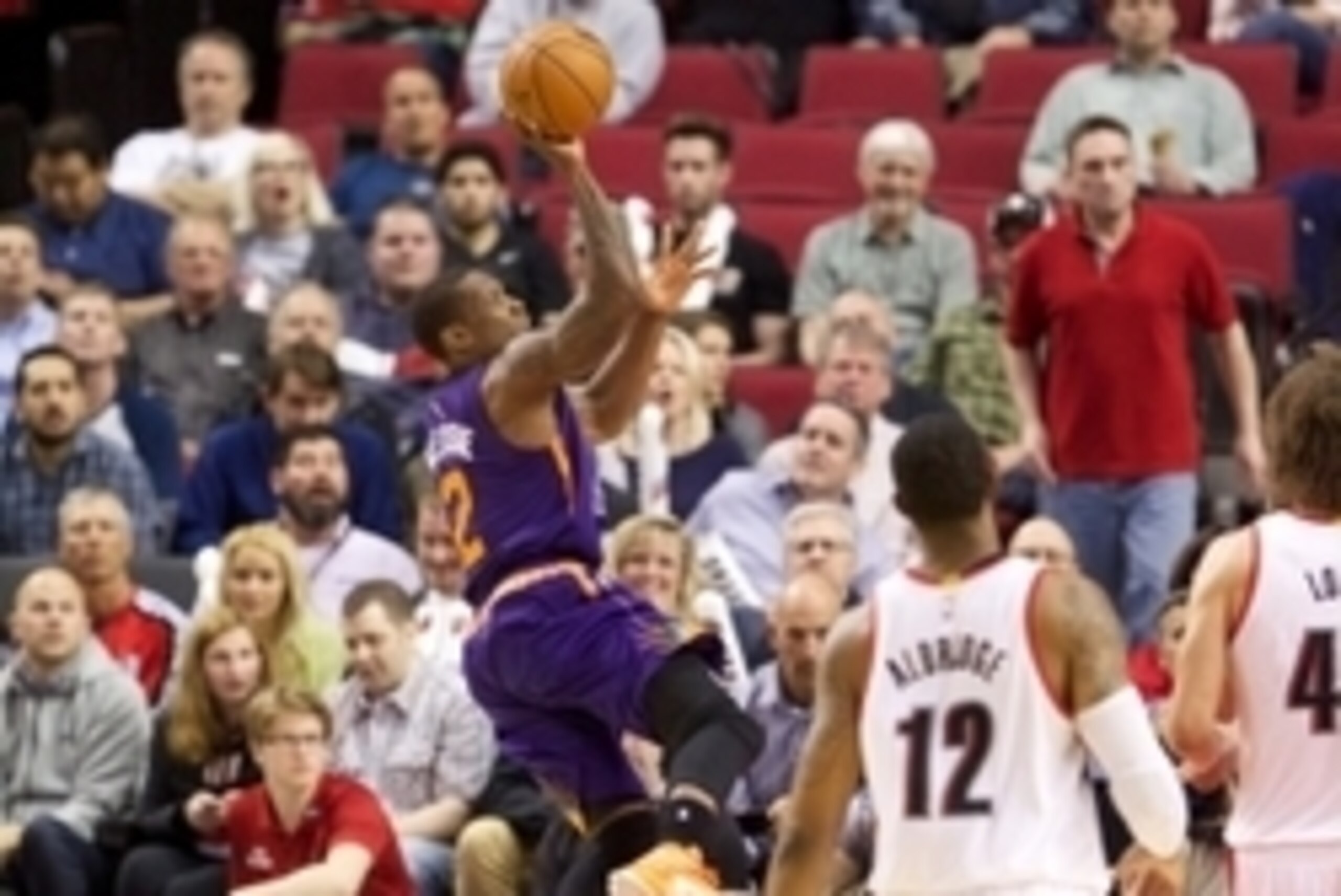 Mar 30, 2015; Portland, OR, USA; Phoenix Suns guard Eric Bledsoe (2) takes an off-balance jump shot against Portland Trail Blazers at Moda Center at the Rose Quarter. Mandatory Credit: Jaime Valdez-USA TODAY Sports