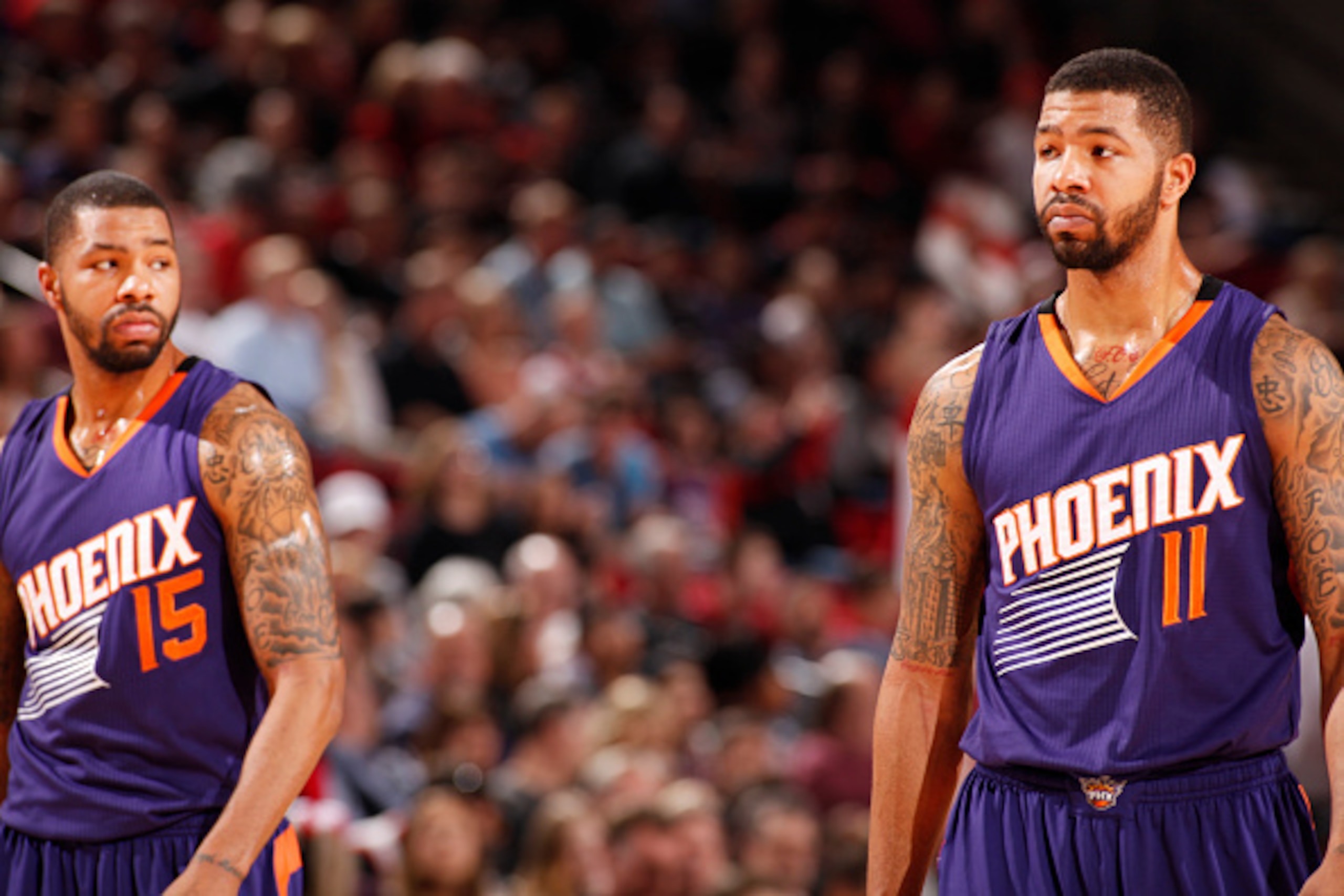 PORTLAND, OR - MARCH 30: Marcus Morris #15 and Markieff Morris #11 of the Phoenix Suns during the game against the Portland Trail Blazers on March 30, 2015 at Moda Center in Portland, Oregon. NOTE TO USER: User expressly acknowledges and agrees that, by d