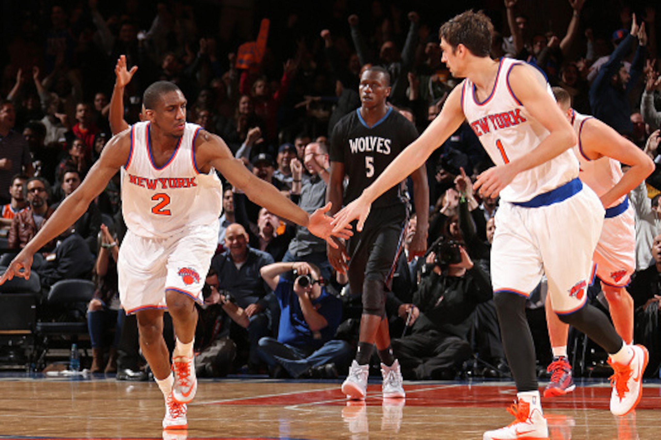 NEW YORK, NY - MARCH 19: Langston Galloway #2 and Alexey Shved #1 of the New York Knicks celebrate during a game against the Minnesota Timberwolves on March 19, 2015 at Madison Square Garden in New York City.  NOTE TO USER: User expressly acknowledges and