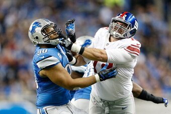 DETROIT, MI - DECEMBER 22: Ndamukong Suh #90 of the Detroit Lions and Justin Pugh #72 of the New York Giants battle during the second quarter of the game at Ford Field on December 22, 2013 in Detroit, Michigan. The Giants defeated the Lions 23-20 in overt